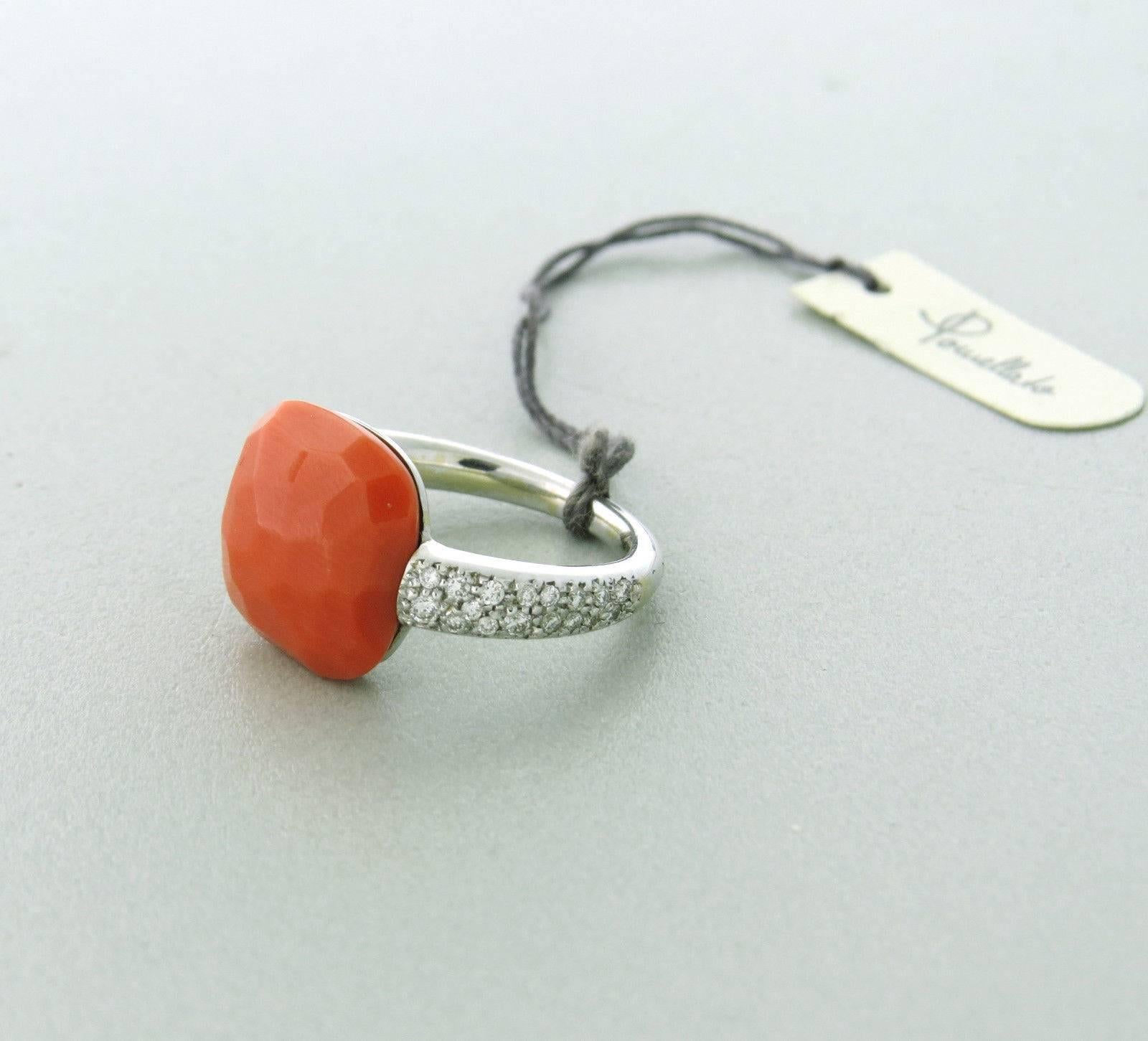 Cute 18k gold ring, crafted by Pomellato for Capri collection, decorated with coral gemstone, surrounded with approximately 0.26ctw in diamonds. Ring size - 6 - 6 1/2, ring top is 13mm x 13mm .  Weight - 7.0 grams