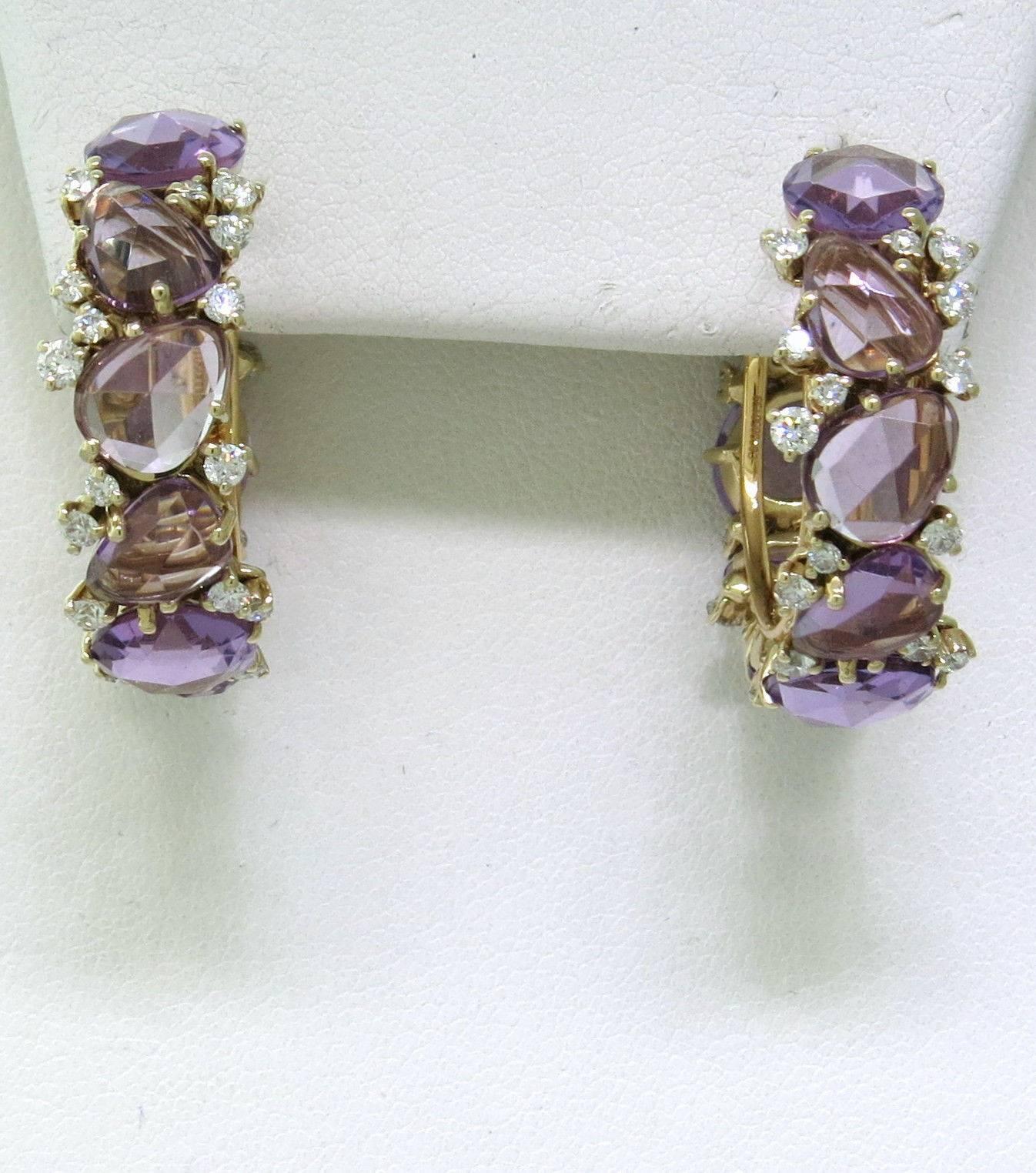 A pair of new impressive hoop earrings, crafted by Pomellato for Lulu collection, decorated with amethyst gemstones and approximately 1.02ctw in G/VS diamonds. Hoops are 28mm in diameter and 8.5mm wide. Weight - 17.3 grams
Retail $17100