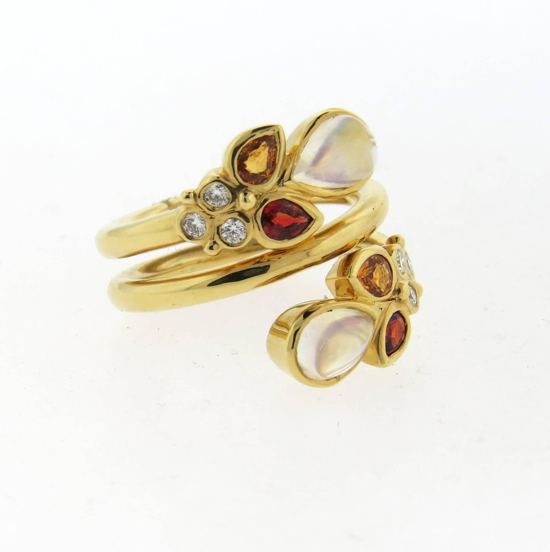 An 18k yellow gold ring, crafted by Temple St. Clair, featuring multi color orange sapphires, diamonds and moonstones. Ring size 7, ring top is 21mm wide. Marked with Temple mark and 750. Weight - 13.1 grams
Retail $5500