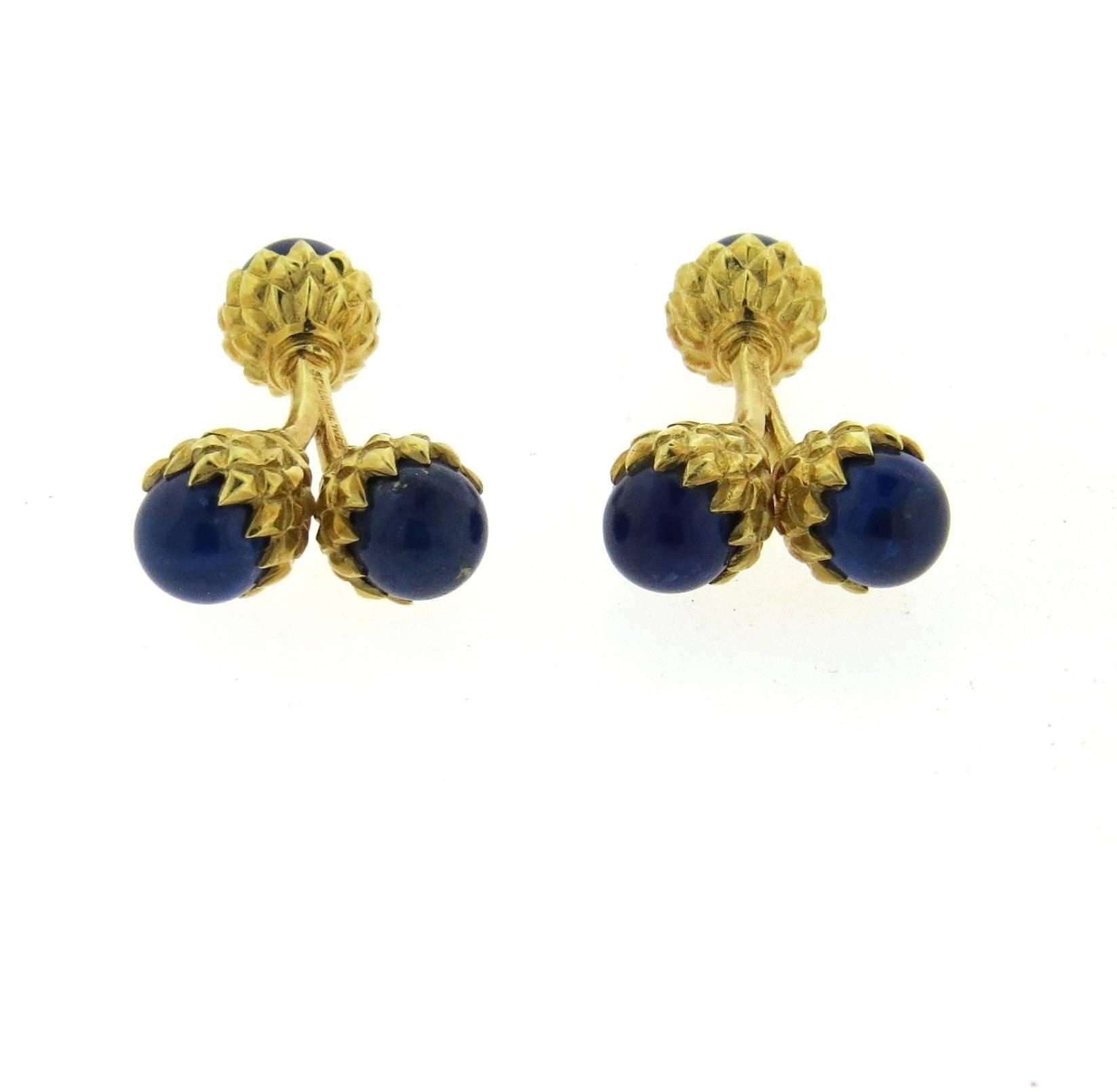 A pair of 18k yellow gold acorn cufflinks, crafted by Jean Schlumberger for Tiffany & Co, featuring lapis lazuli stones. Each acorn measures 9.6mm in diameter . Marked: Schlumberger, Tiffany 18k. Weight - 16.1 grams
