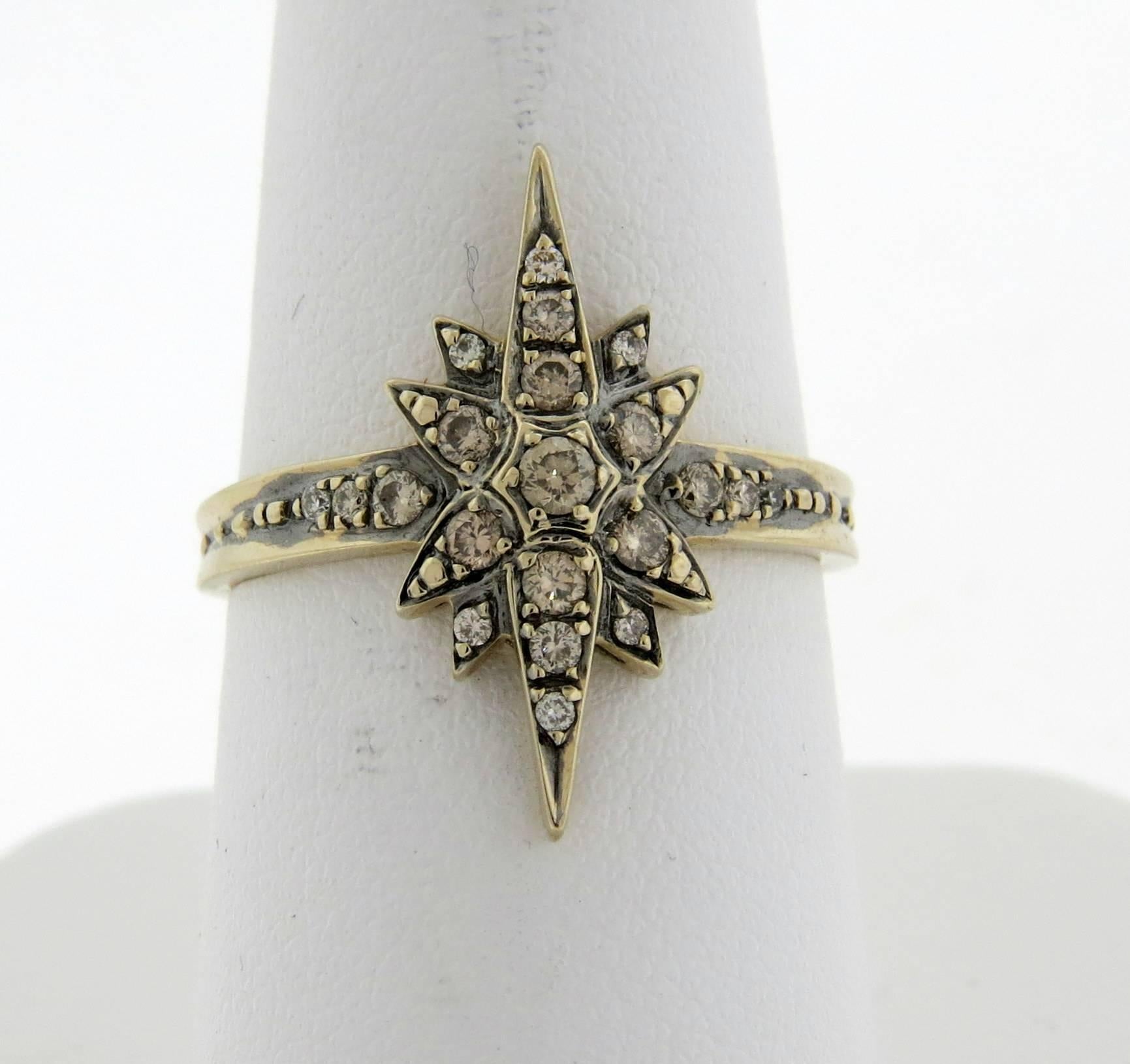 An 18k gold star ring, crafted by H. Stern for Stars collection, set with approx. 0.40ctw in fancy brown diamonds. Ring size 7 1/2, ring top is 21mm x 10mm . Marked;  750, S mark, signature Star . Weight - 3.8 grams