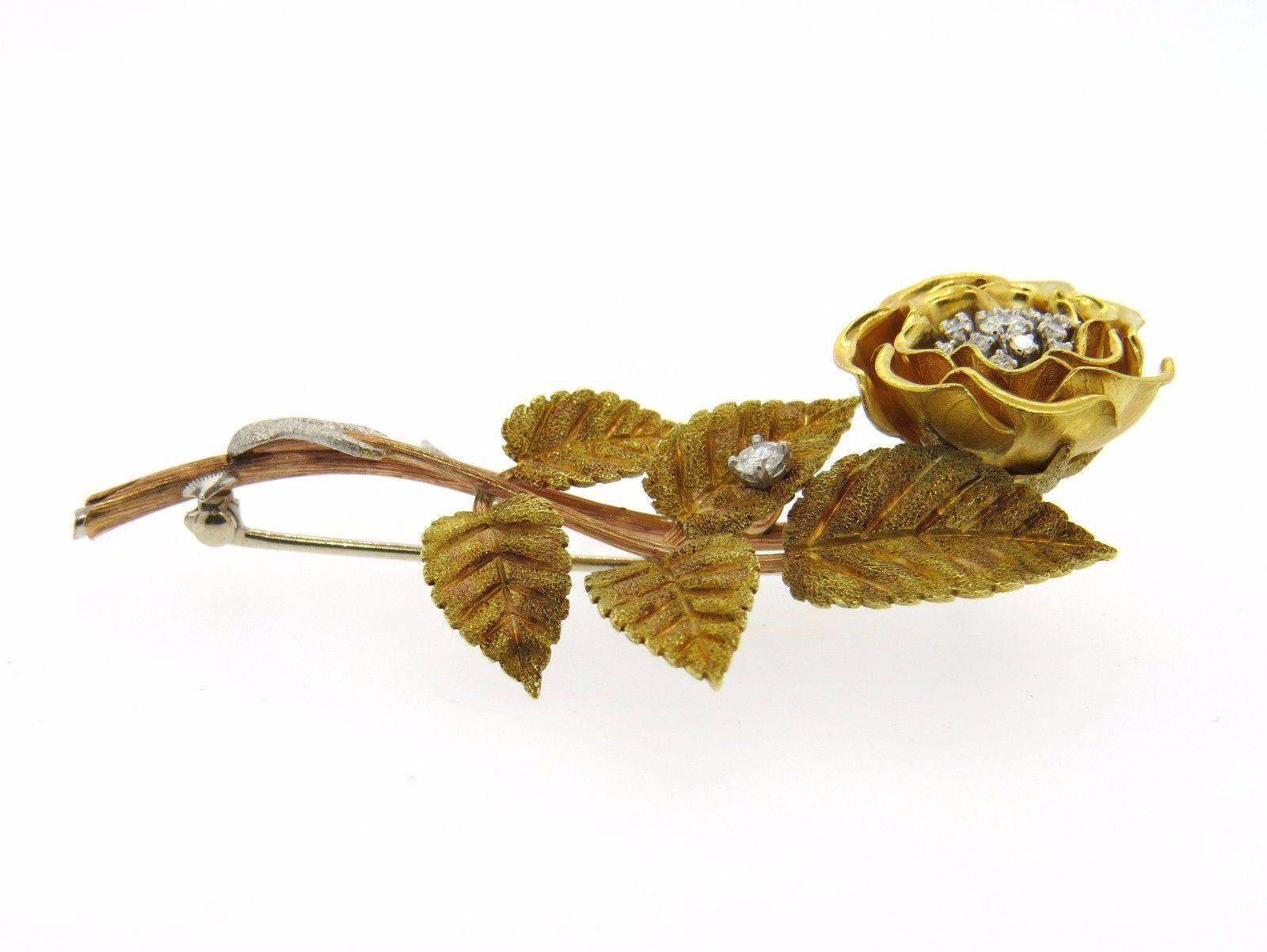 An 18k gold flower brooch set with diamonds.  Crafted in the manner of Xavier Zirnkilton, the brooch measures 72mm x 40mm.  The weight of the piece is  20.3 grams.