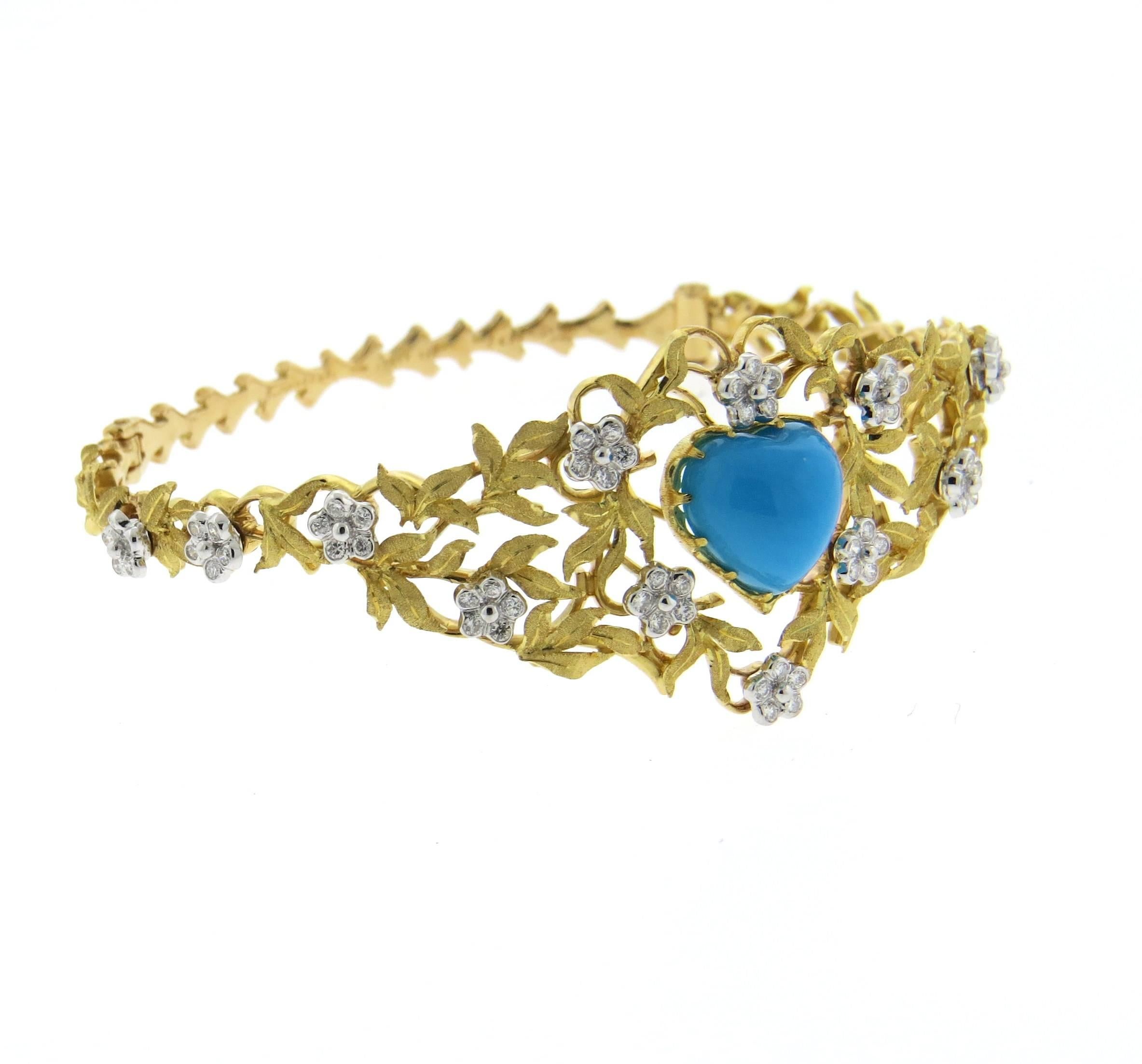 Beautiful 18k gold bangle bracelet, adorned with diamonds and heart shape turquoise in the center. Bracelet will comfortably fit up to 7