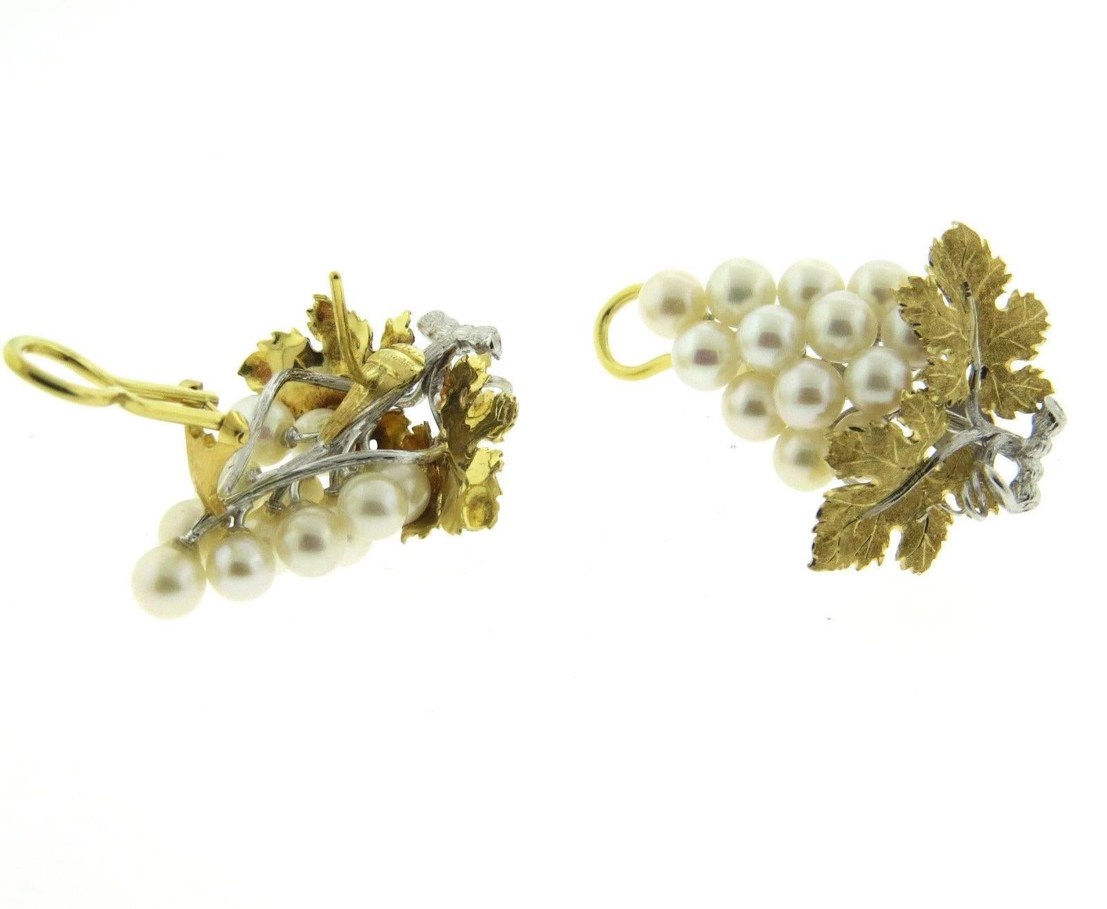 A pair of 18k yellow and white gold grape vine earrings set with 5.3mm - 5.5mm pearls.  Crafted by Buccellati, the earrings measure 35mm x 30mm and weigh 17.7 grams.  Marked: Buccellati Italy. Earrings coome with original Buccellati paperwork.