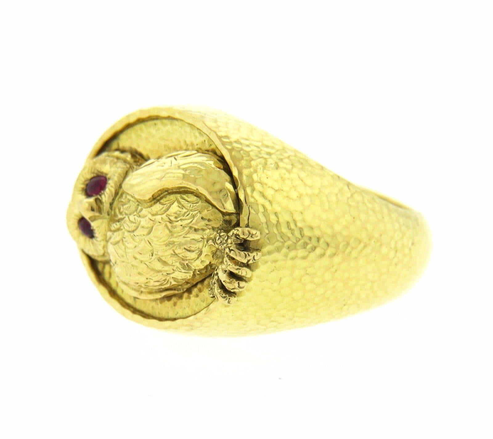 An 18k yellow gold ring set with rubies.  Crafted by David Webb, the ring is a size 6.25, top measures 15.8mm at widest point.  Marked: Webb 18K.  The weight of the ring is 15.5 grams.