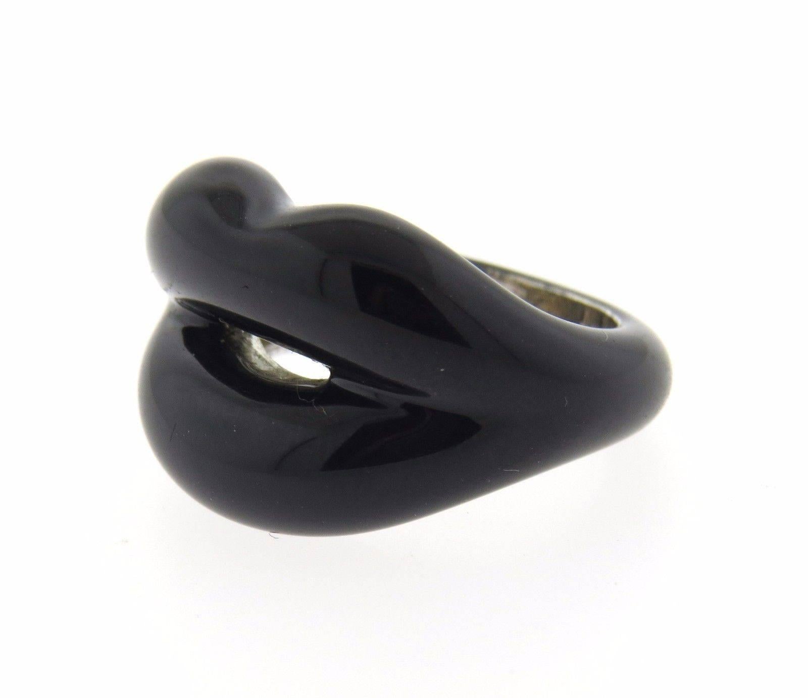 A sterling silver ring adorned with black enamel.  The ring is a size 3.75, top measures 16mm at widest point.  The ring has a weight of 12 grams.  Marked: S-AP 925.