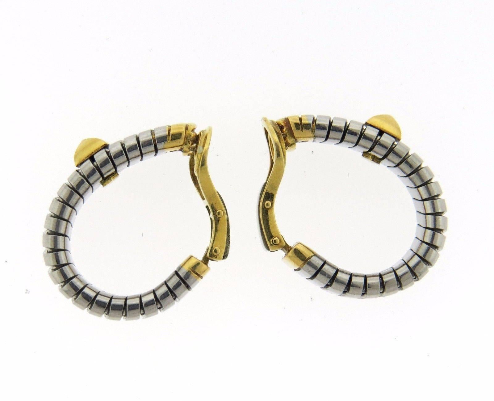 A pair of 18k yellow gold, and steel earrings from the Tubogas collection by Bulgari.  The earrings measure 29mm long x 8.1mm wide and weigh 21.5 grams.  Marked: Bvlgari, M, 750.