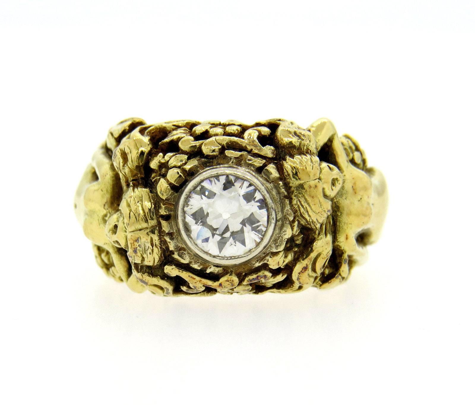 An 18k yellow gold ring set with an H/SI1 old European cut diamond weighing approximately 0.90cts.  The ring is a size 8 1/2, ring top is 13.5mm at widest point.  The weight of the piece is 23.2 grams.