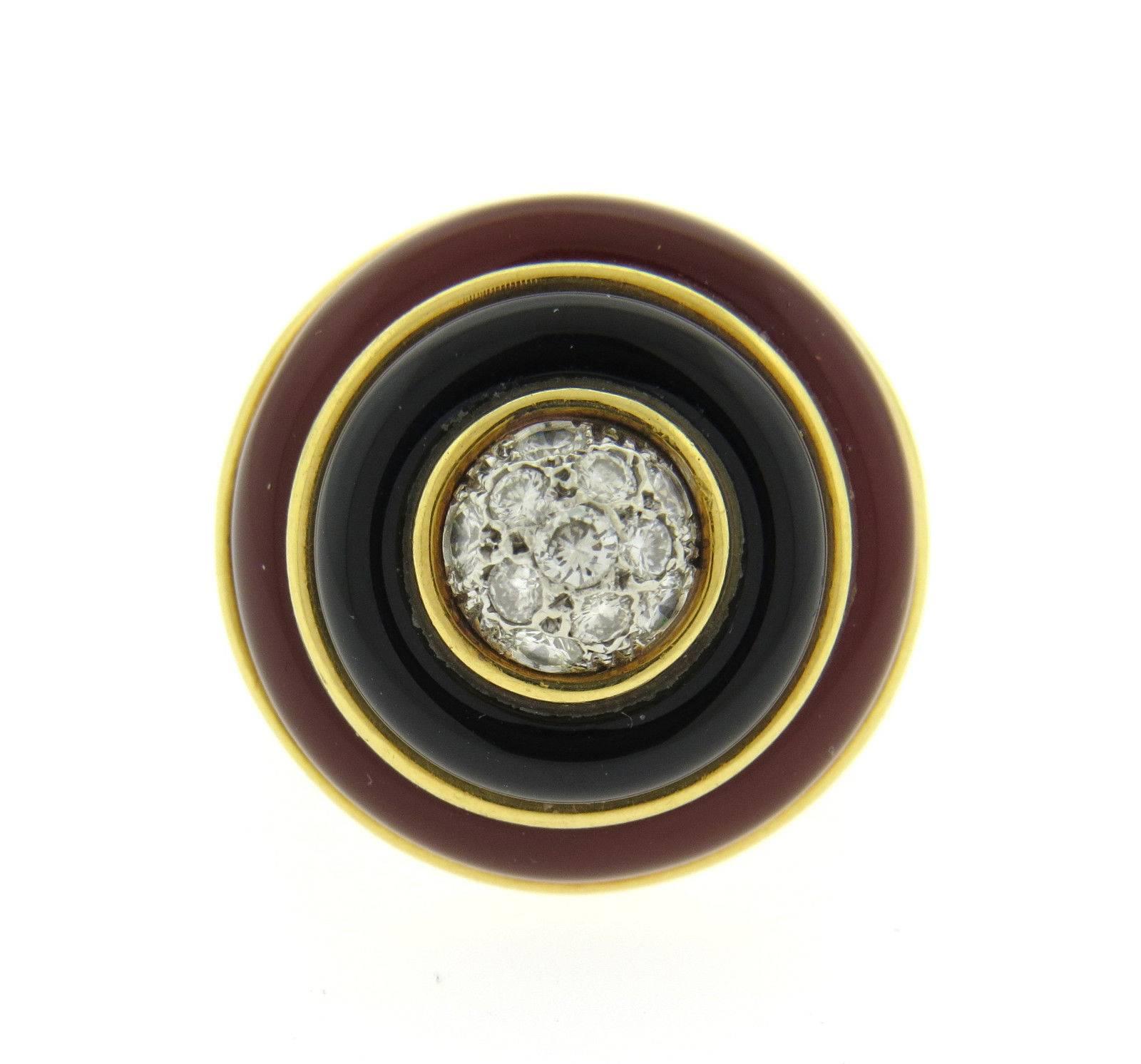 An 18k yellow gold ring set with onyx, carnelian and approximately 0.28ctw of G/VS diamonds.  The ring is a size 6 3/4, ring top is 21mm in diamonds and sits approx. 16mm from the finger.  The weight of the ring is 26 grams.  Marked: Tiffany & Co,