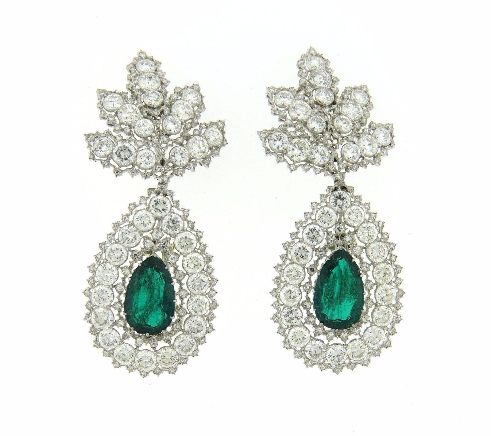 A pair of 18k gold earrings set with approximately 16 carats of diamonds and pear shaped emeralds.  The Earrings measure 70mm x 29mm, top portion measures 30mm x 32mm and teardrop bottom portion measures 40mm x 28mm.  Marked:	Buccellati, Italy, 750.