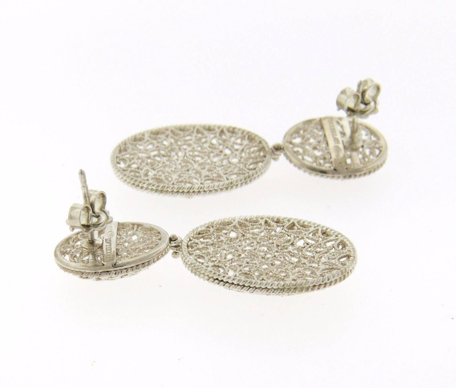 A pair of sterling silver earrings by Buccellati.  The earrings measure 46mm x 21mm and weigh 9.4 grams.  Marked: Buccellati Italy 925.  The earrings come with Buccellati paperwork.