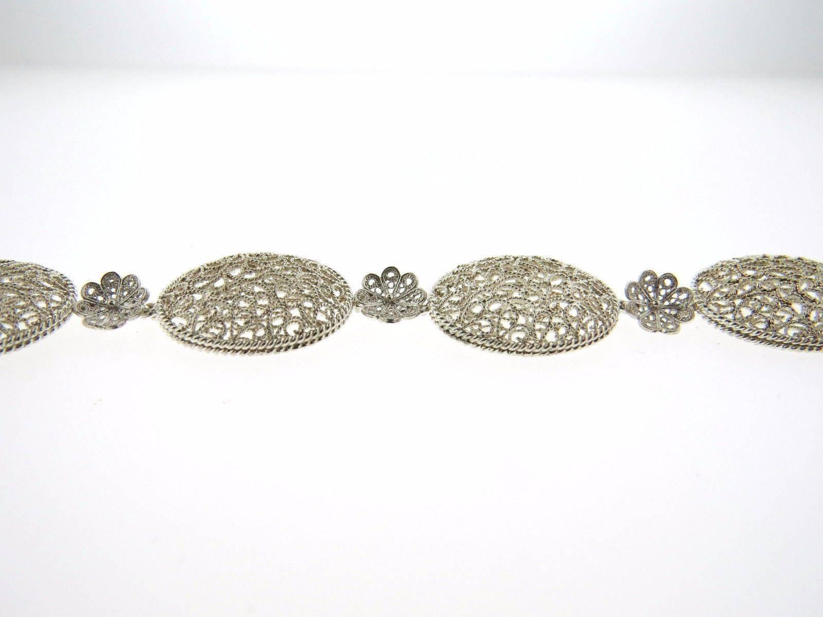 A sterling silver bracelet by Buccellati.  The bracelet measures 7.5" long and is 17.5mm wide.  The weight of the piece is 13.2 grams.  Marked: Buccellati 925.  Comes with Buccellati paperwork.
