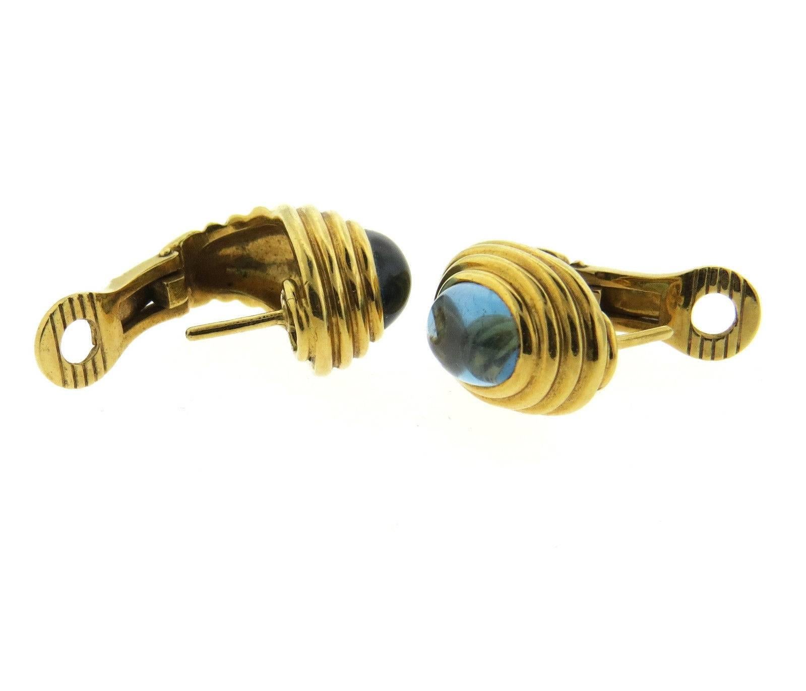 A pair of 18k yellow gold earrings set with bluegemstone cabochons (9.8mm x 7.6mm).  The earrings measure 20mm x 12mm and weigh 20.2 grams.  Marked: Bvlgari, 750, Italian marks.