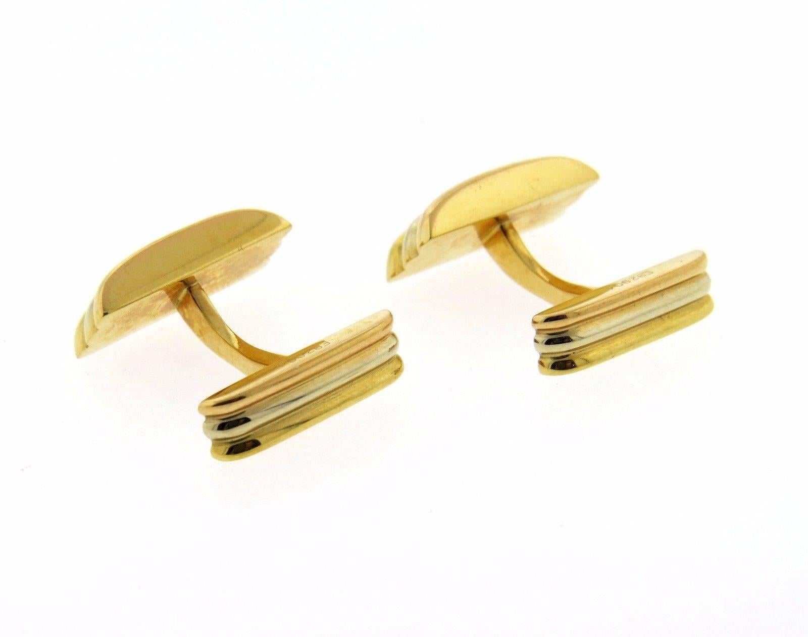 A pair of 18K white, rose and yellow gold cufflinks by Cartier.  The cufflinks measure 17.4mm x 8.4mm and weigh 13.5 grams. Marked: Cartier 1989, 750.