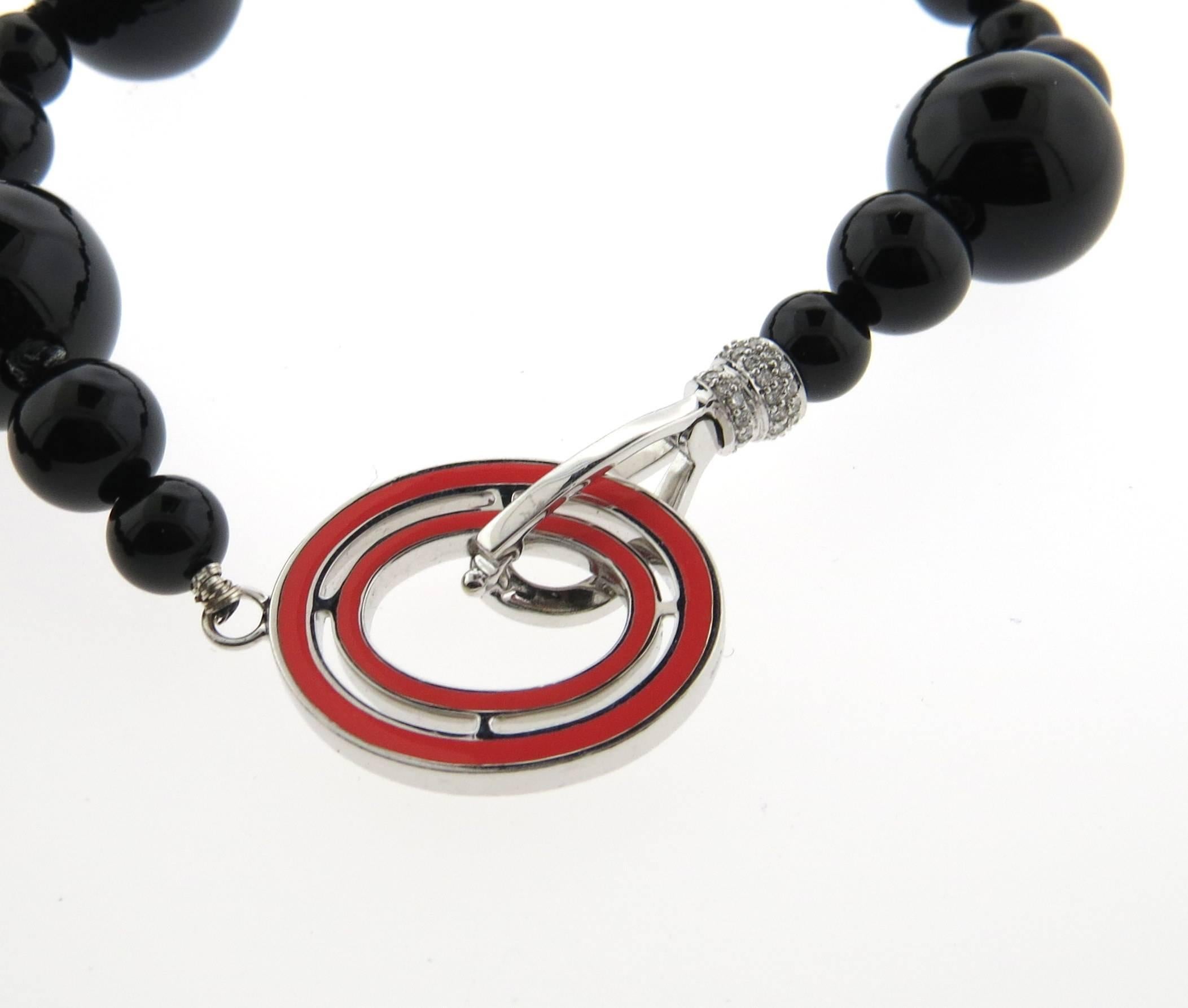 New 18k white gold long necklace, crafted by Ivanka Trump, featuring 6.4mm to 14.3mm onyx beads and approx. 0.87ctw in G/VS diamonds.  Necklace is  38 1/2" long, clasp measures 38mm x 20mm. Marked: Ivanka Trump,750, N10459. Weight - 136.7
