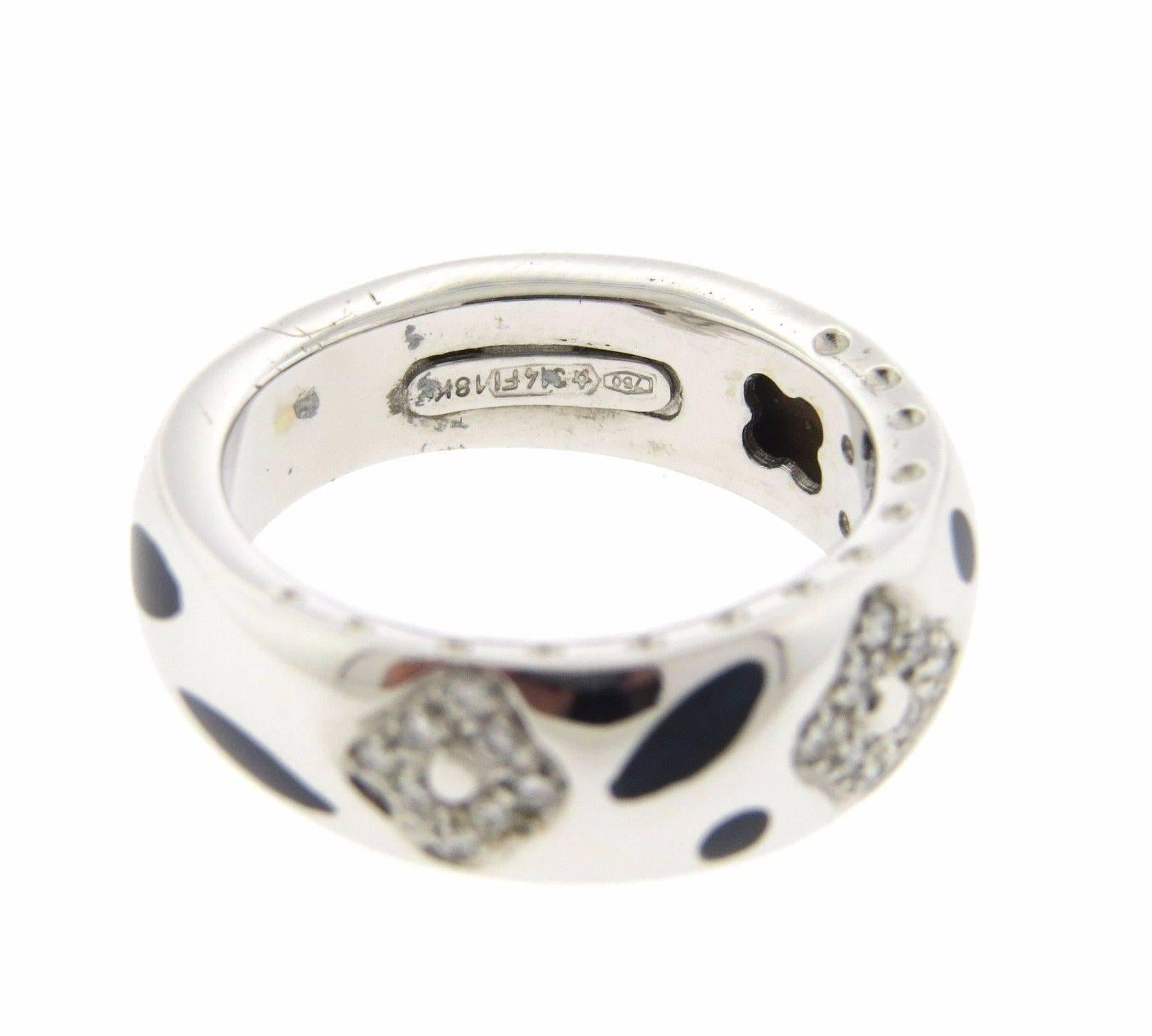 An 18k white gold ring adorned with enamel and approximately 0.20ctw of H/VS diamonds.  The ring is a size 6 3/4 and is 7.2mm wide.  The weight  of the ring is 8.1 grams. Marked: LNB, 750, 18Kt.  The current retail of the piece is $2100.