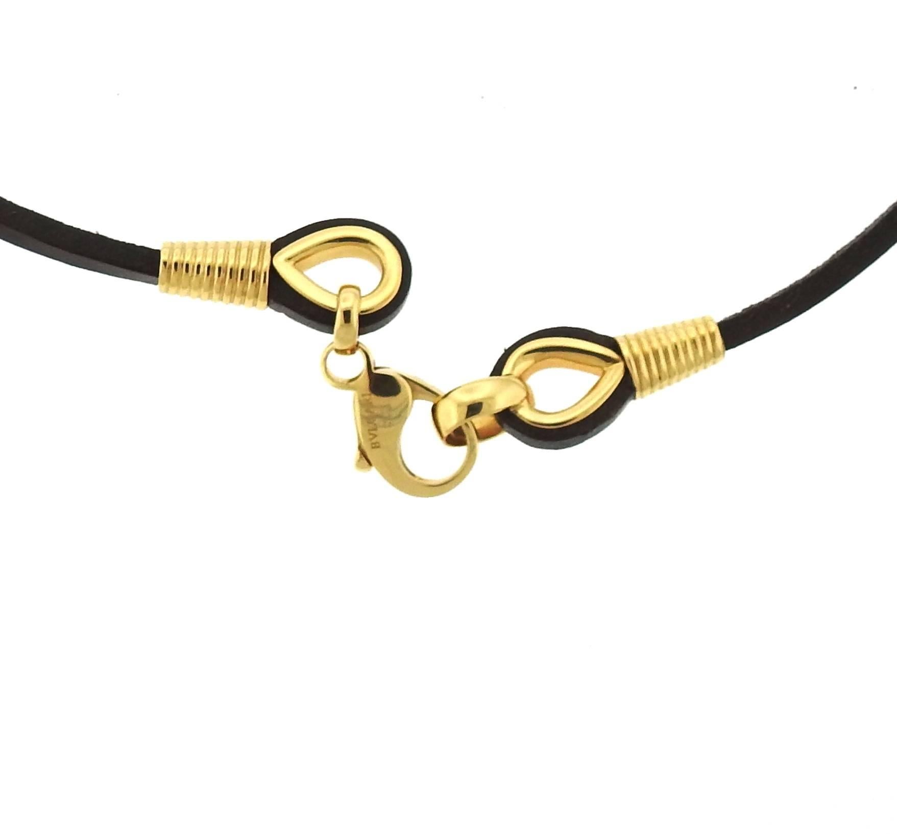 An 18k gold and leather necklace, crafted by Bulgari. Necklace is 17 7/8