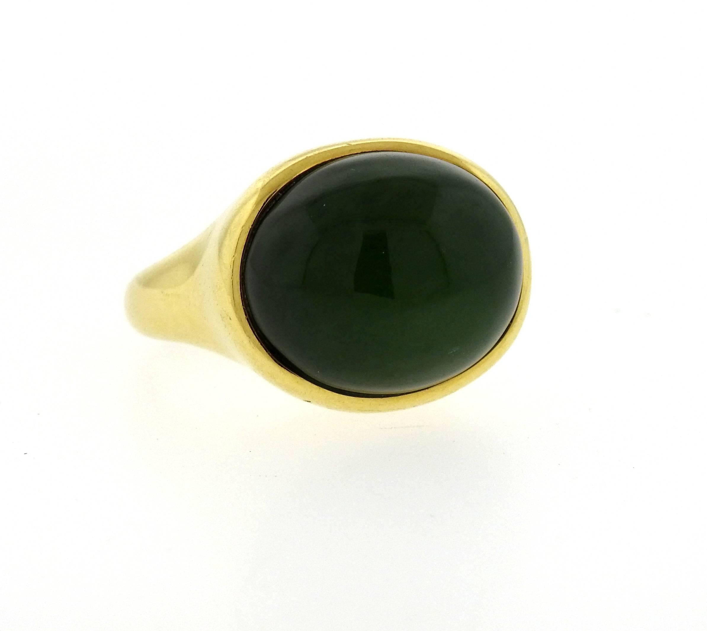 Large 18k yellow gold ring, crafted by Elsa Peretti, featuring 17mm x 19.5mm  jade cabochon. Ring size - 7, ring top is 18mm x 21mm, sits approx. 16mm from the finger . Marked: Tiffany 7 Co, Elsa Peretti, 750, Hong Kong. Weight - 22.9 grams
