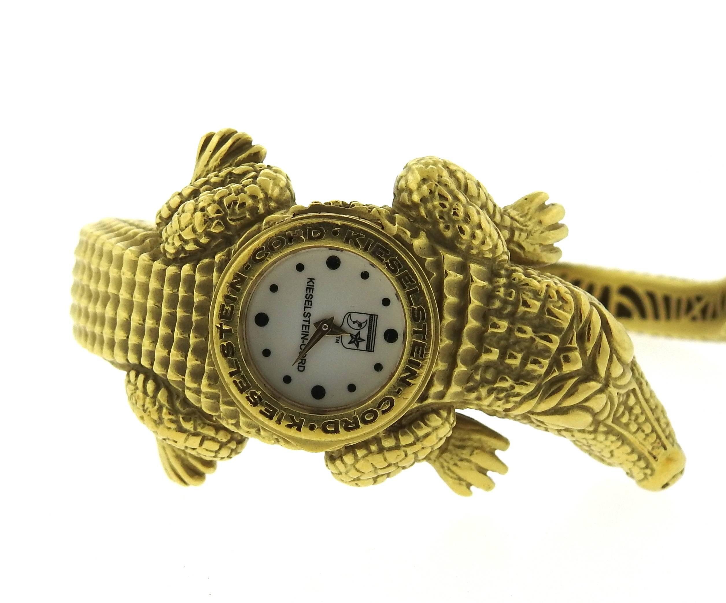 An 18k yellow gold watch bracelet, crafted by Kieselstein-Cord, featuring famous alligator design. Bracelet will fit up to 7