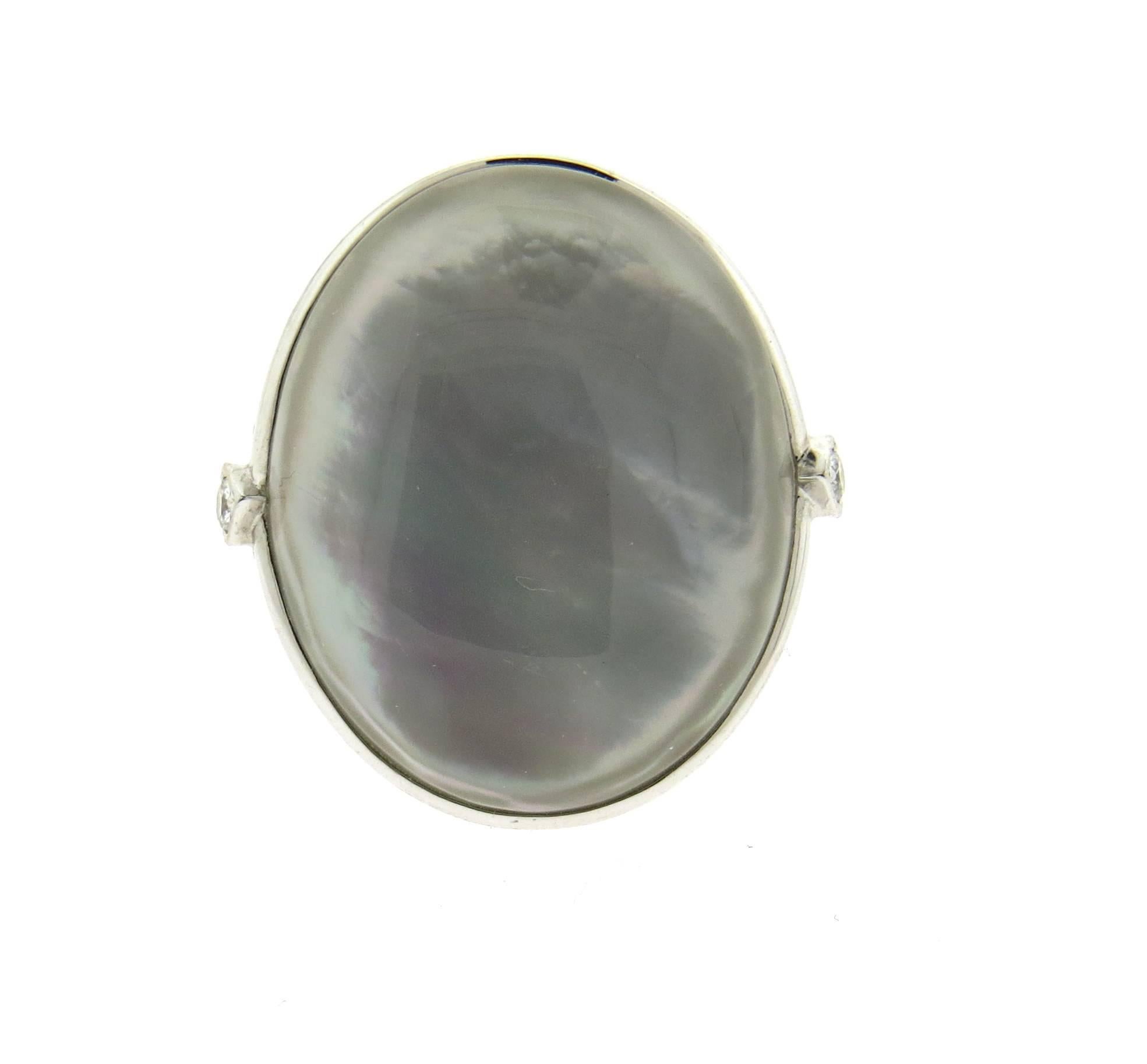 New large 18k white gold ring, crafted by Ivanka Trump, featuring oval mother of pearl top, surrounded with approx. 0.51ctw in diamonds. Ring size 7 1/4, ring top is 29mm x 27mm. Marked: Ivanka Trump 750, N7108. Weight of the piece - 18.2