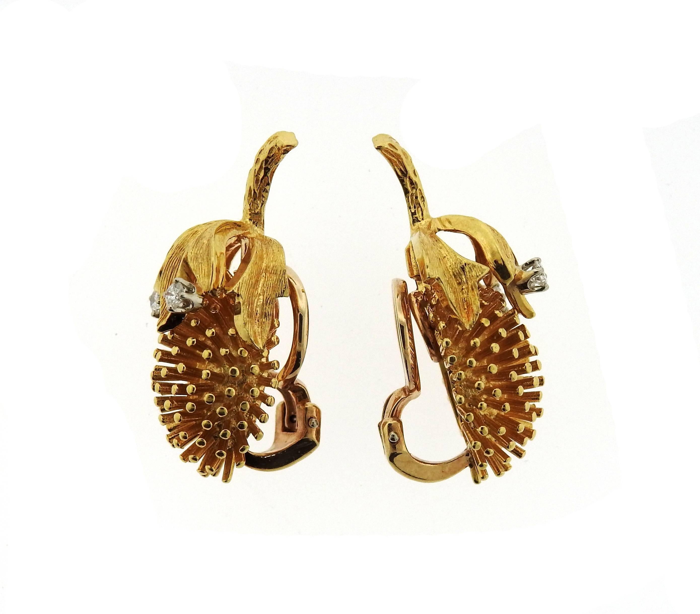 A pair of 14k yellow gold earrings set with approximately 0.20ctw of H/VS diamonds.  The earrings measure 30mm x 15mm and weigh 17 grams.  Marked: 14k, CDL.