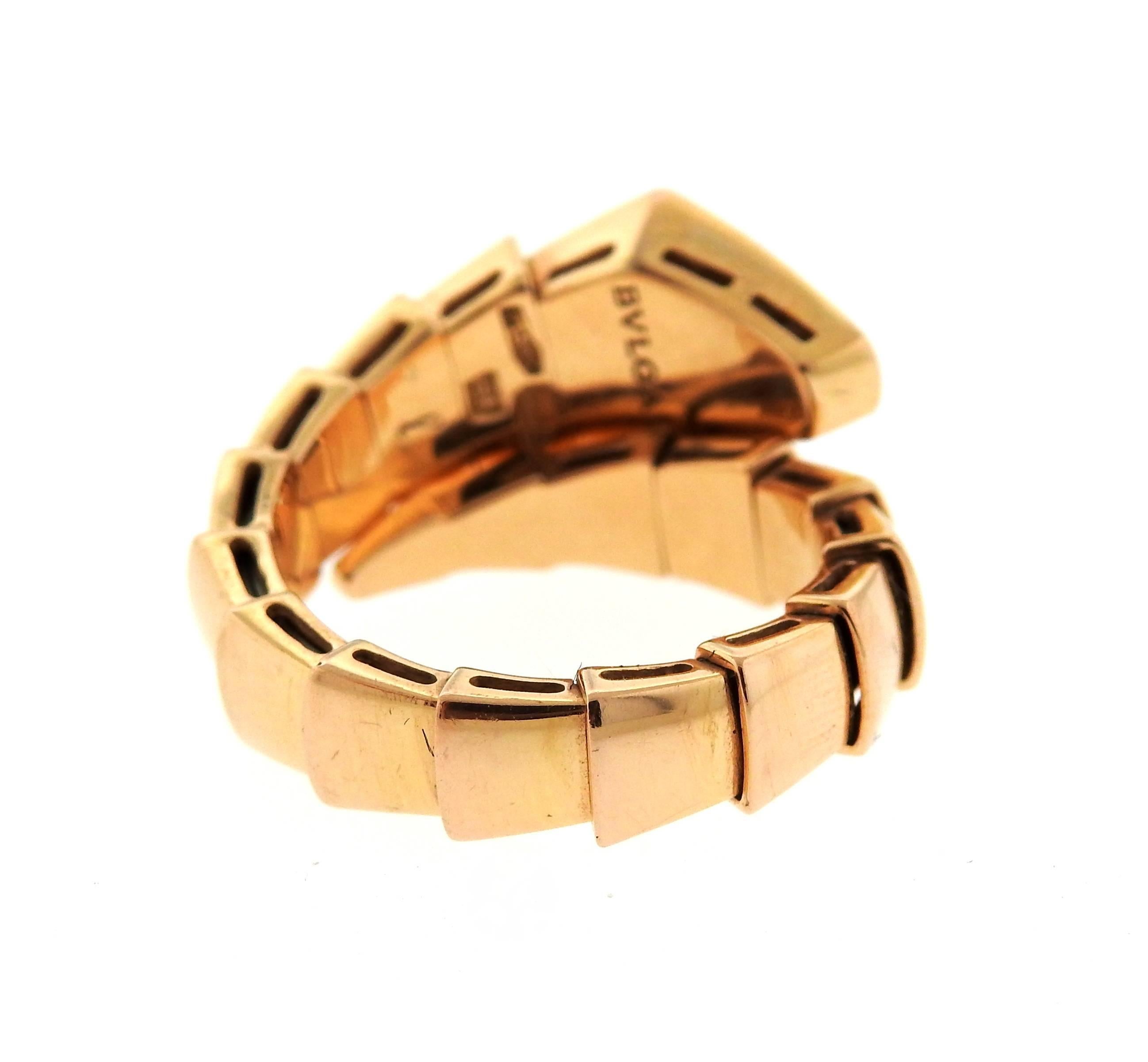 An 18k rose gold ring set with approximately 0.34ctw of G/VS diamonds.  The ring size is flexible due to construction of the ring - approx. 7.  The weight of the piece is 10.1 grams.  Marked: Bvlgari, l, 2337AL, made in Italy, 750.  The current