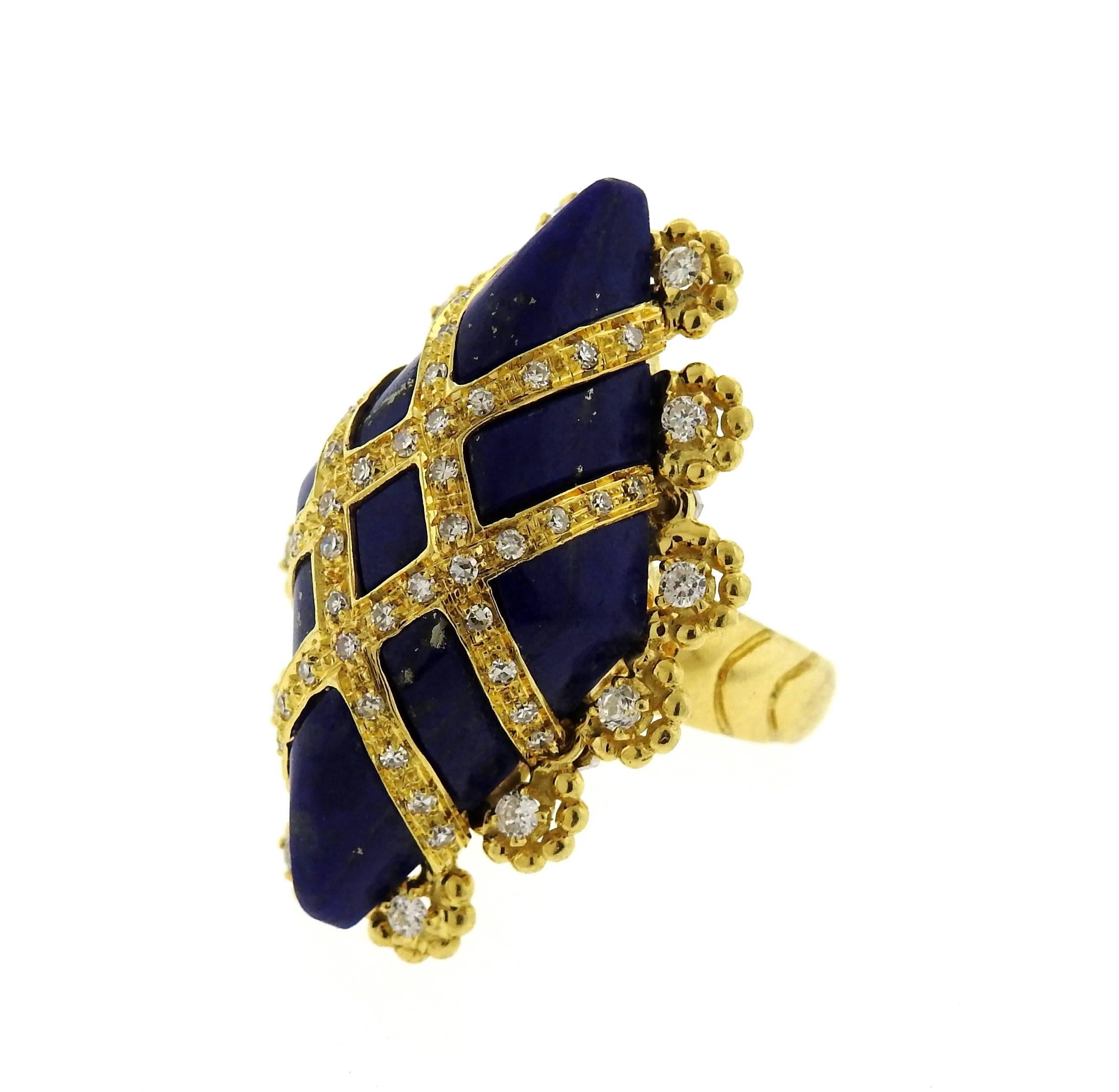 An 18K yellow gold ring set with lapis and approximately 0.60ctw of H/VS-SI diamonds.  The ring is a size 5, ring top is 33mm x 22mm.  Marked: 750.  The weight of the piece is 18.2 grams.