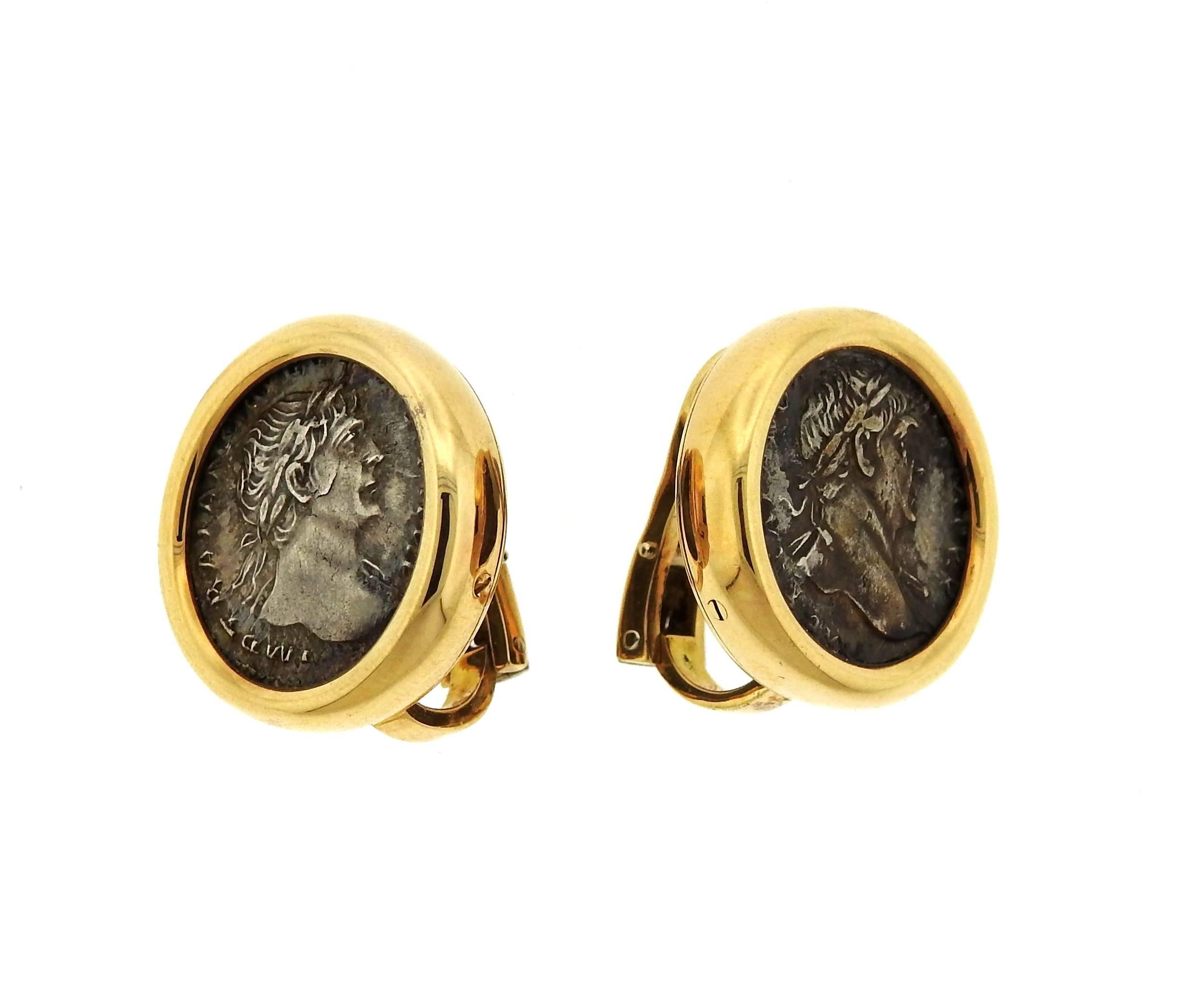 A pair of 18K yellow gold earrings set with ancient coins. The earrings are 21.5mm in diameter.  Marked: Bvlgari, 750, 277 TO, Roma-Traianvs A.D. 98-117.  The earrings weigh 27.1 grams.