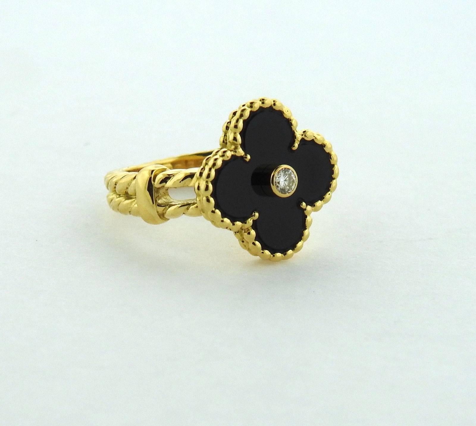 AN 18k yellow gold ring, crafted by Van Cleef & Arpels for iconic Vintage Alhambra collection, featuring black onyx clover top with a 0.06ct diamond in the center. Ring size - 4 3/4, ring top (clover) measures 14.5mm x 14.5mm . Marked: VCA, 18KT,