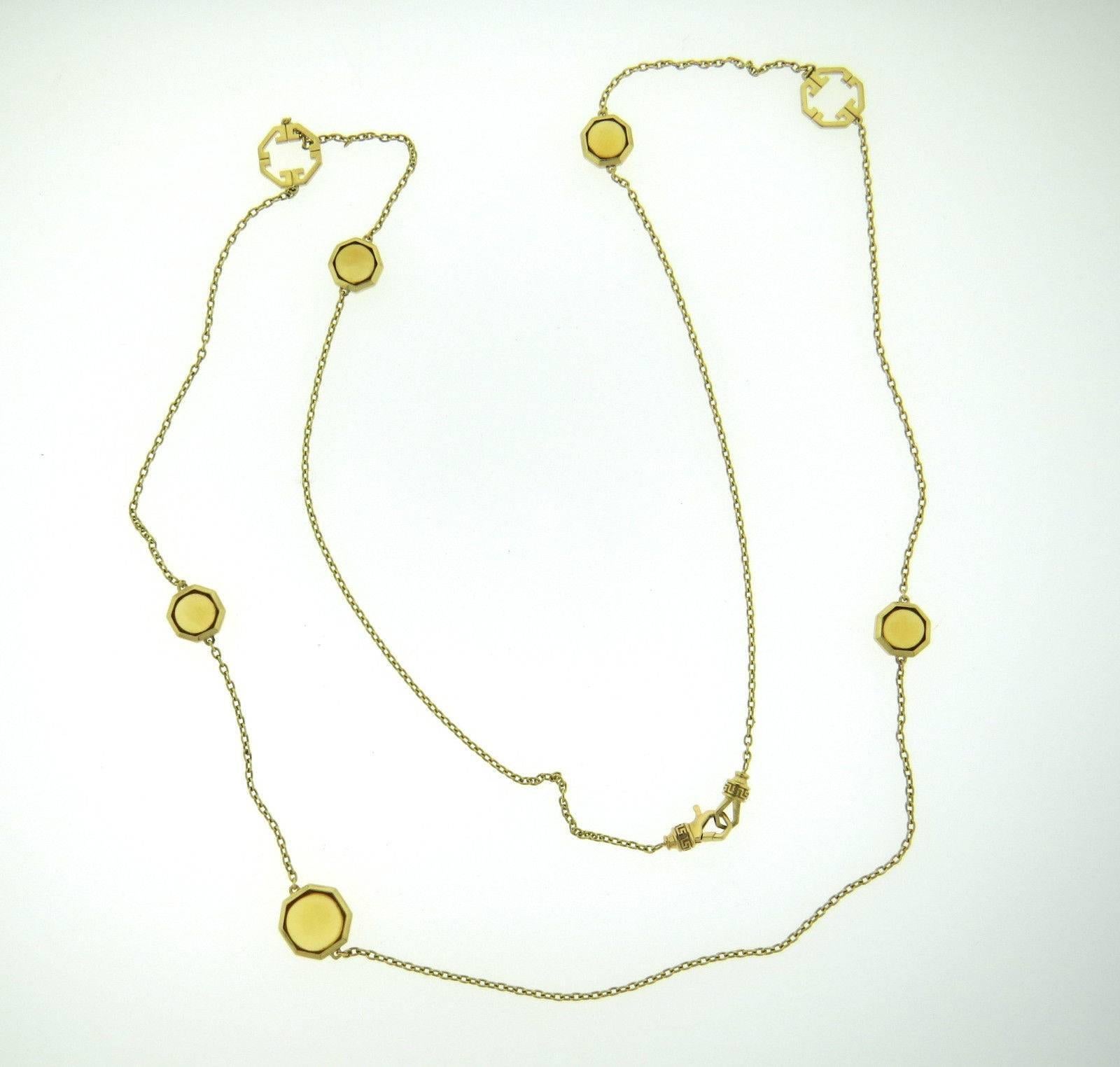 An 18k yellow gold necklace set with citrines.  The necklace is 36 1/4