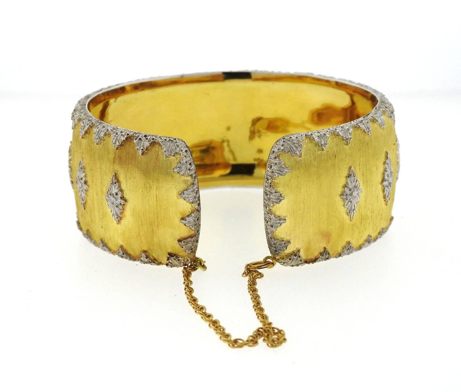 An 18k yellow and white gold cuff bracelet by Buccellati.  The bracelet will fit up to a 6 3/4
