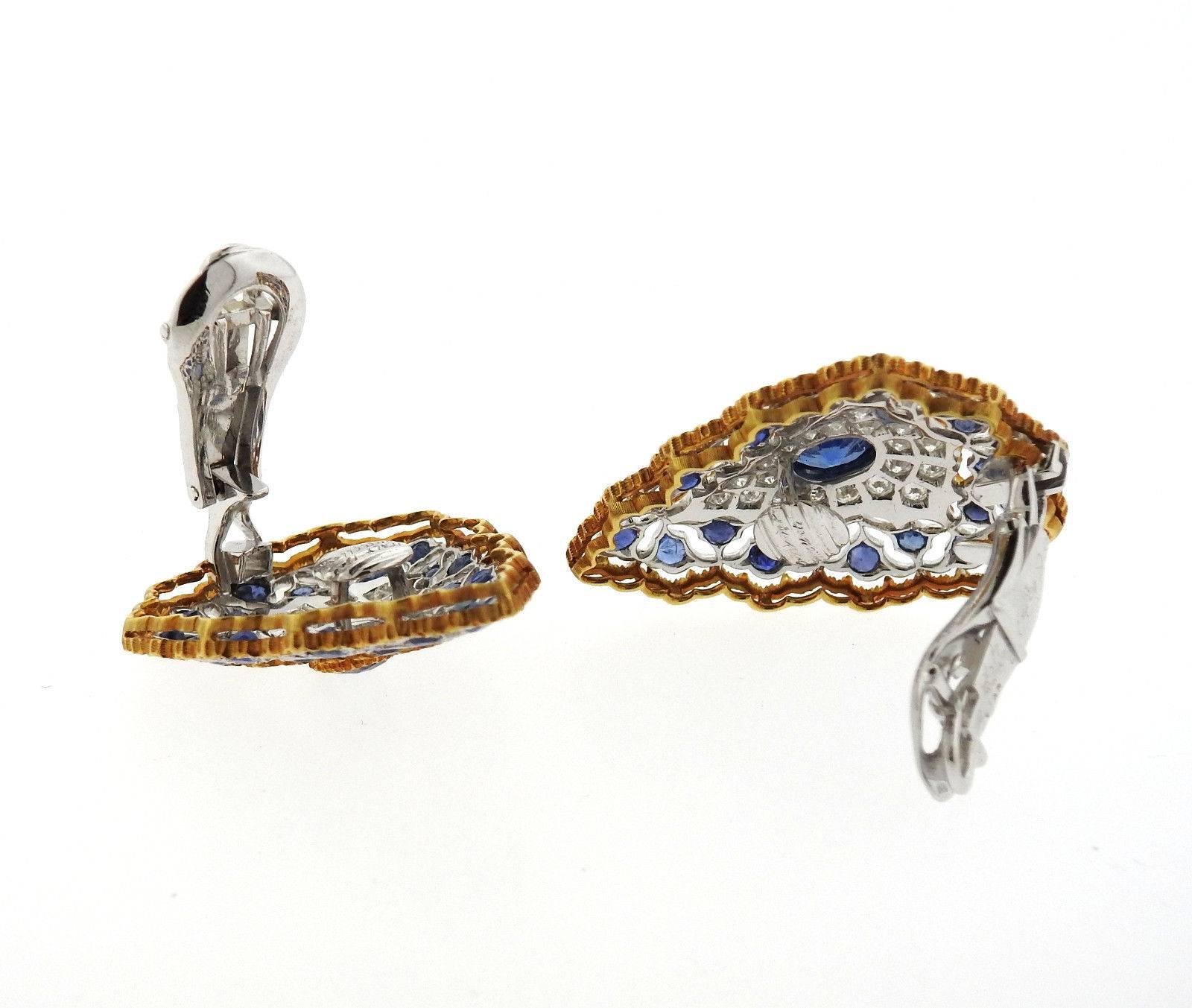 A pair of 18k yellow and white gold earrings set with sapphires and approximately 1 carat of GH/VS diamonds.  The earrings measure 35mm x 25mm and weigh 17.2 grams.  Marked: Buccellati, Italy, 18k.

