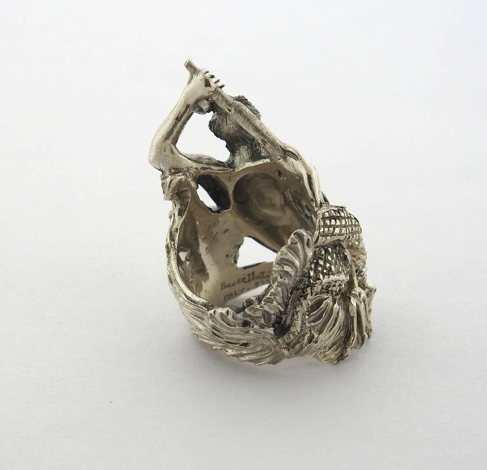 A sterling silver ring depicting Poseidon.  The ring is a size 6, ring top is 36mm wide at the widest point.  The weight of the piece is 19.9 grams.  Marked: Buccellati, Italy, 925.  Comes with Buccellati paperwork.