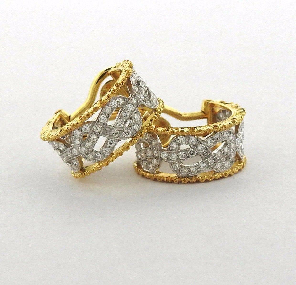 A pair of 18k yellow and white gold hoop earrings set with approximately 0.89ctw of GH/VS diamonds.  The earrings measure 18mm in diameter x 8mm wide and weigh 7.9 grams. Marked: Buccellati, Italy, 18k. Comes with Buccellati paperwork. Retail $21030.