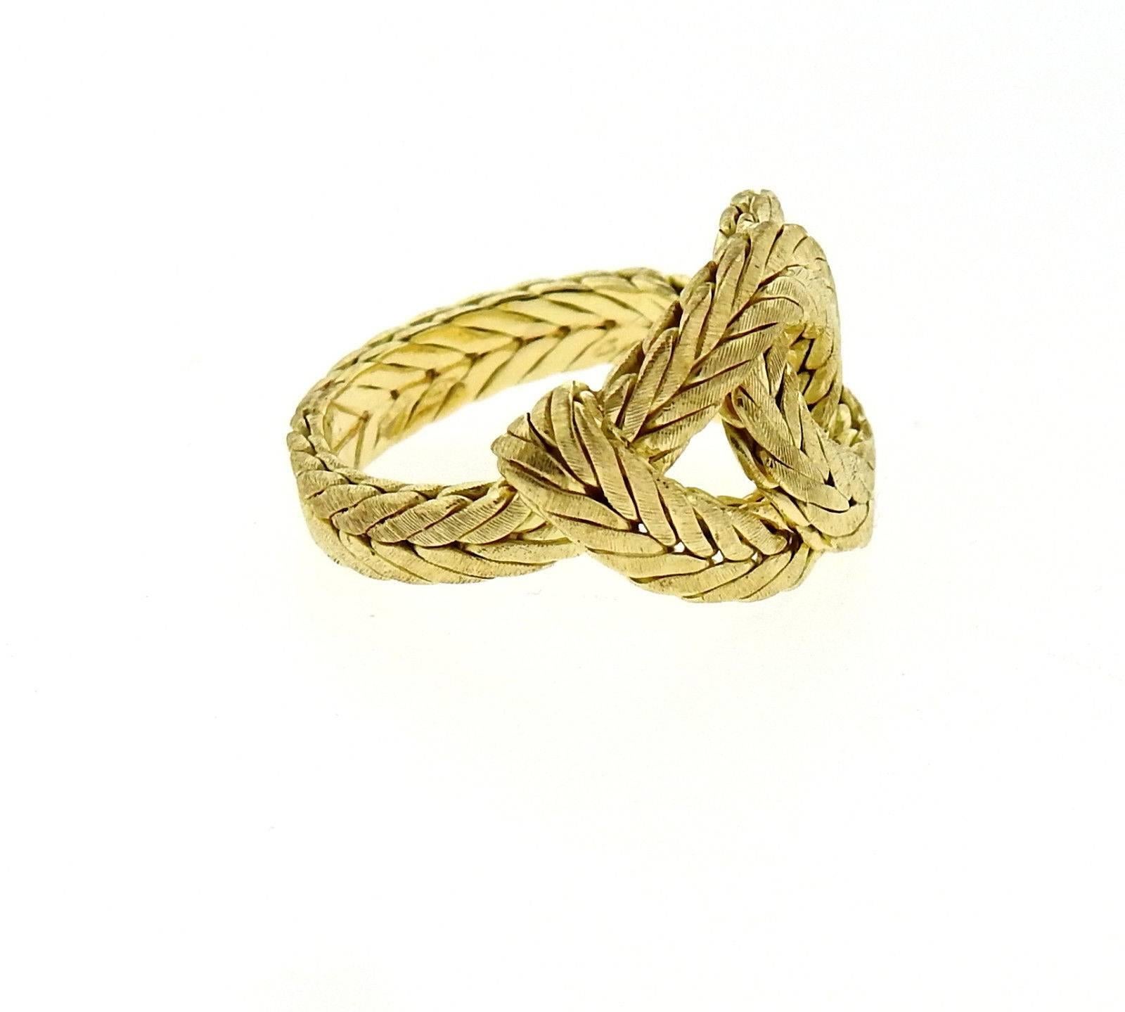 An 18k yellow gold knot ring by Buccellati.  The ring is a size 5 1/2, ring top is 13mm wide.  The weight of the piece is 7.7 grams.  Marked: 750, Italian mark, Italy, Buccellati.  Current retail is $3590.
