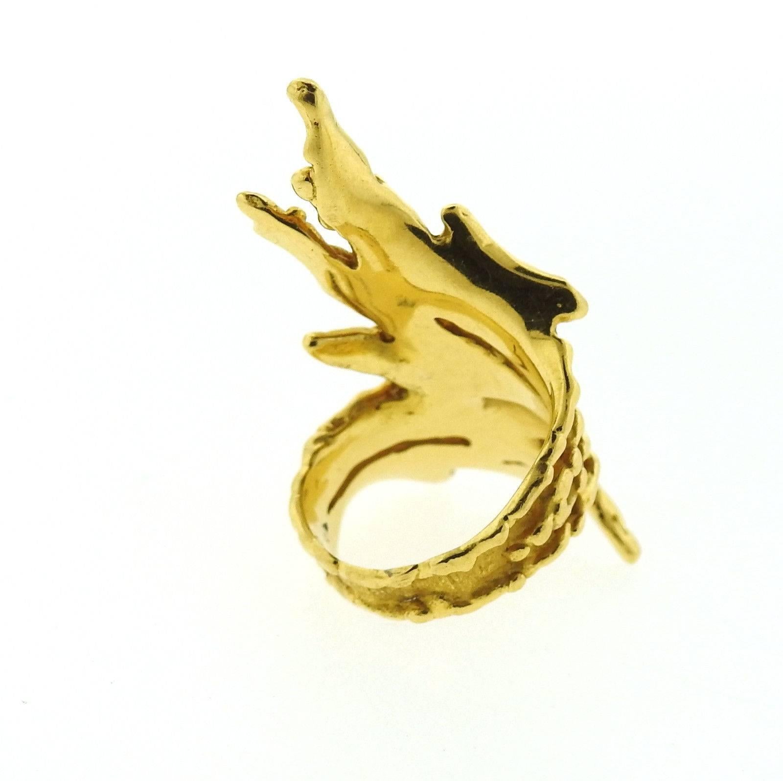 An 18k yellow gold ring set with approximately 0.09ctw of HI/SI diamonds.  The ring is a size 6, ring top is 45mm wide.  The weight of the ring is 14.3 grams.