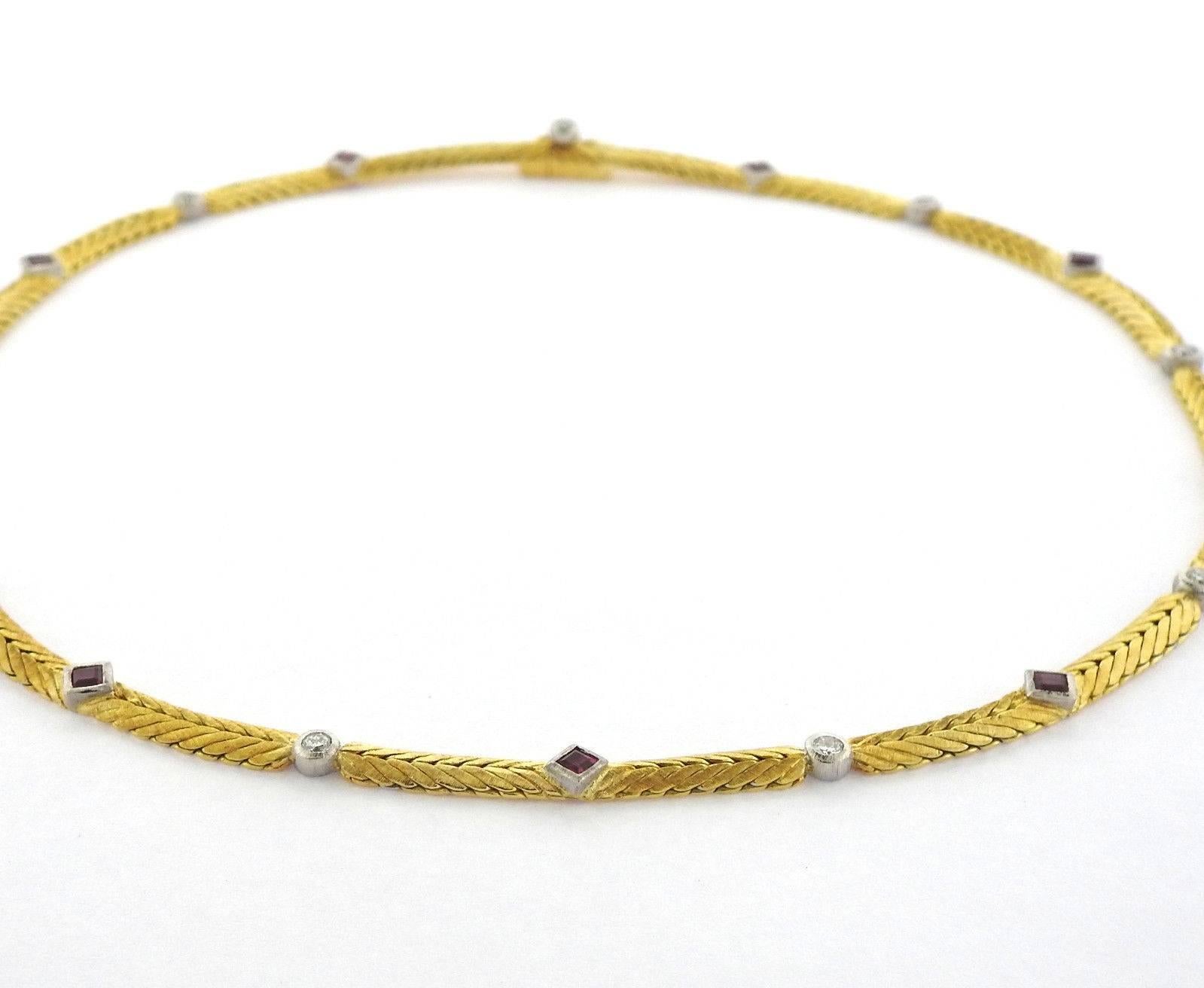 An 18k yellow and white gold necklace set with 0.59ctw of rubies and 0.45ctw of H/VS diamonds.  The necklace is 14 1/2