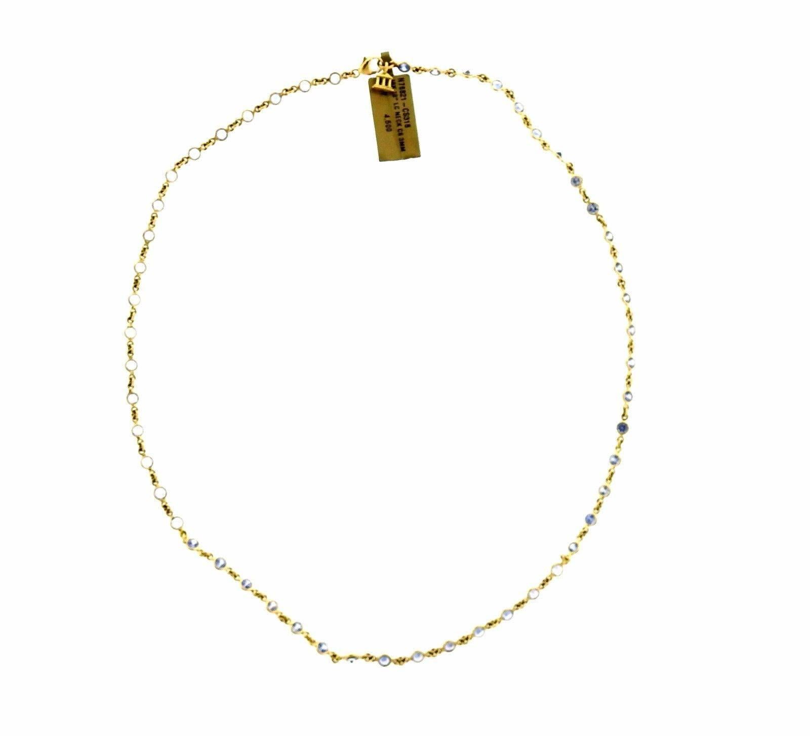 An 18k yellow gold necklace set with blue sapphires.  The necklace is 17.5