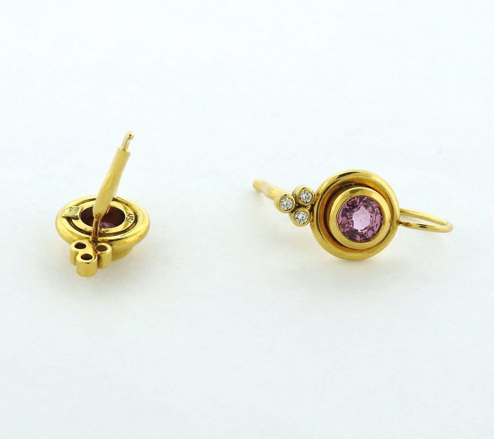 A pair of 18k yellow gold earrings set with pink tourmaline and 0.09ctw of G/VS diamonds.  The earrings are 21mm long with wire x 11mm wide.  The weight of the pair is 6.6 grams.  Marked: Temple mark, 750. Current retail is $4200.