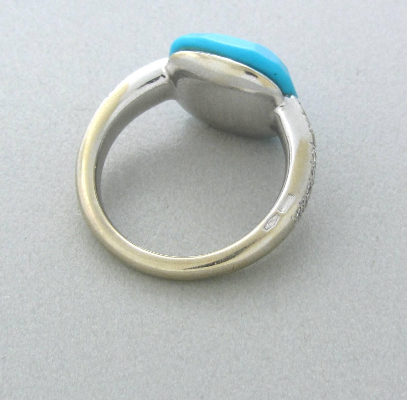 Pomellato 18k white gold ring crafted for the Capri collection. Features turquoise(13mm x 12.7mm) and 0.26ctw of G/VS diamonds. Marked Pomellato 750. Weight- 7.3 grams. Ring size 4.5. Ring retails for $4350