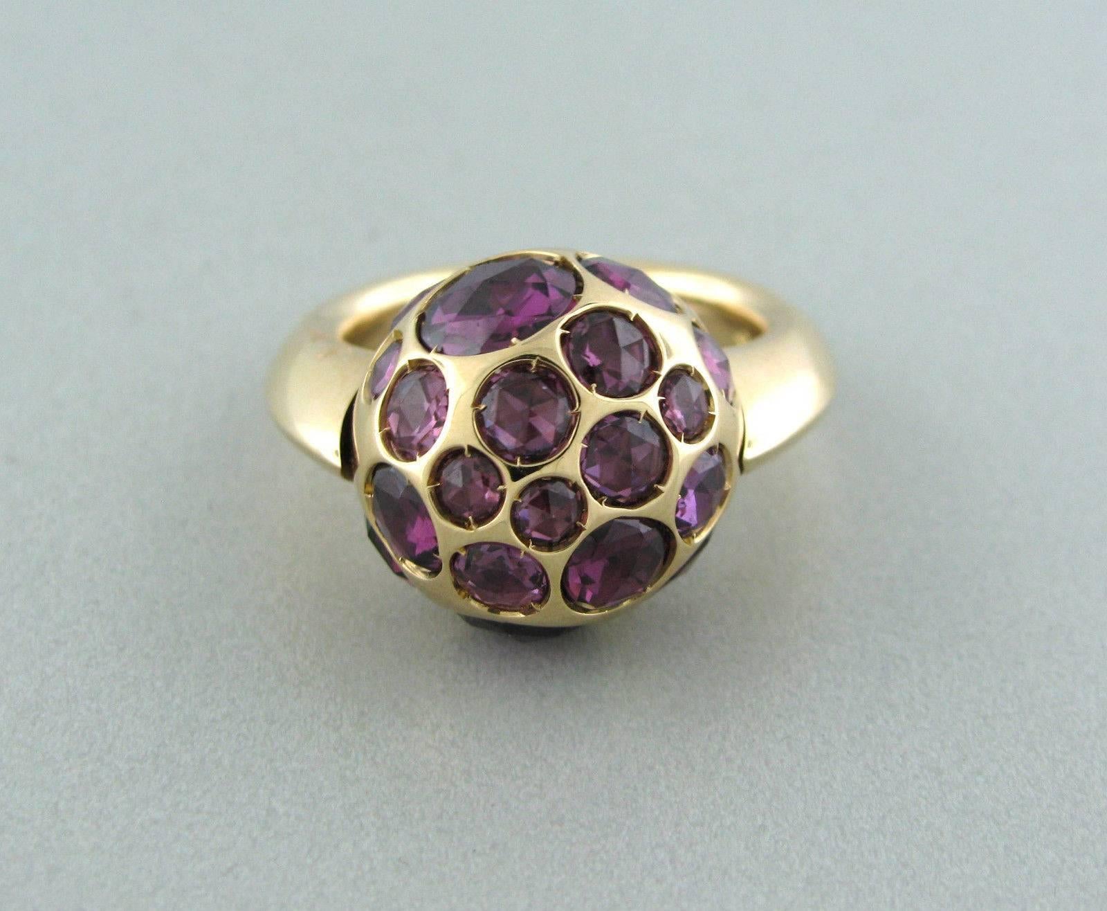 Pomellato 18k gold ring crafted for the Harem collection. Features rhodolite and garnet. Ring top measures 17mm in diameter. Marked 750, Pomellato. Weight-19.8 grams. Ring size 6.5. Ring retails for $7170.