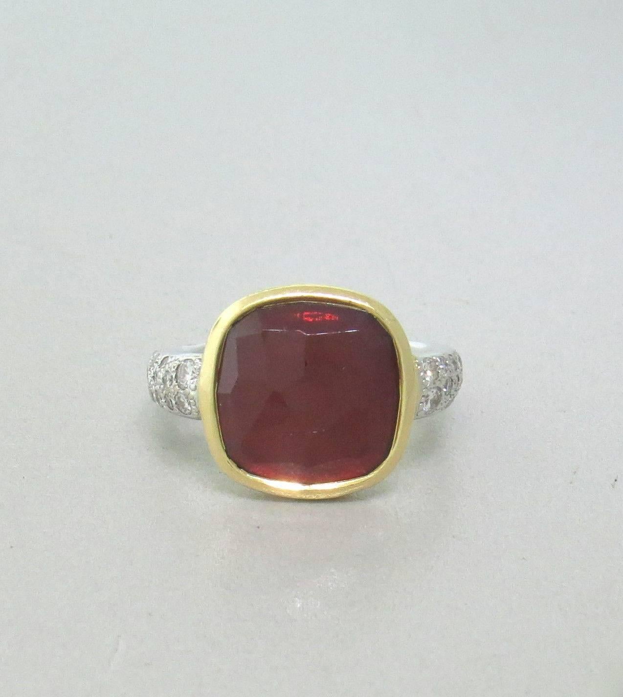 Pomellato ring crafted for the Scheherazade collection. Features Red Tourmaline and approximately 0.40ctw in VS-SI/G-H diamonds. Ring size 4.5. Weight- 8.0 grams.