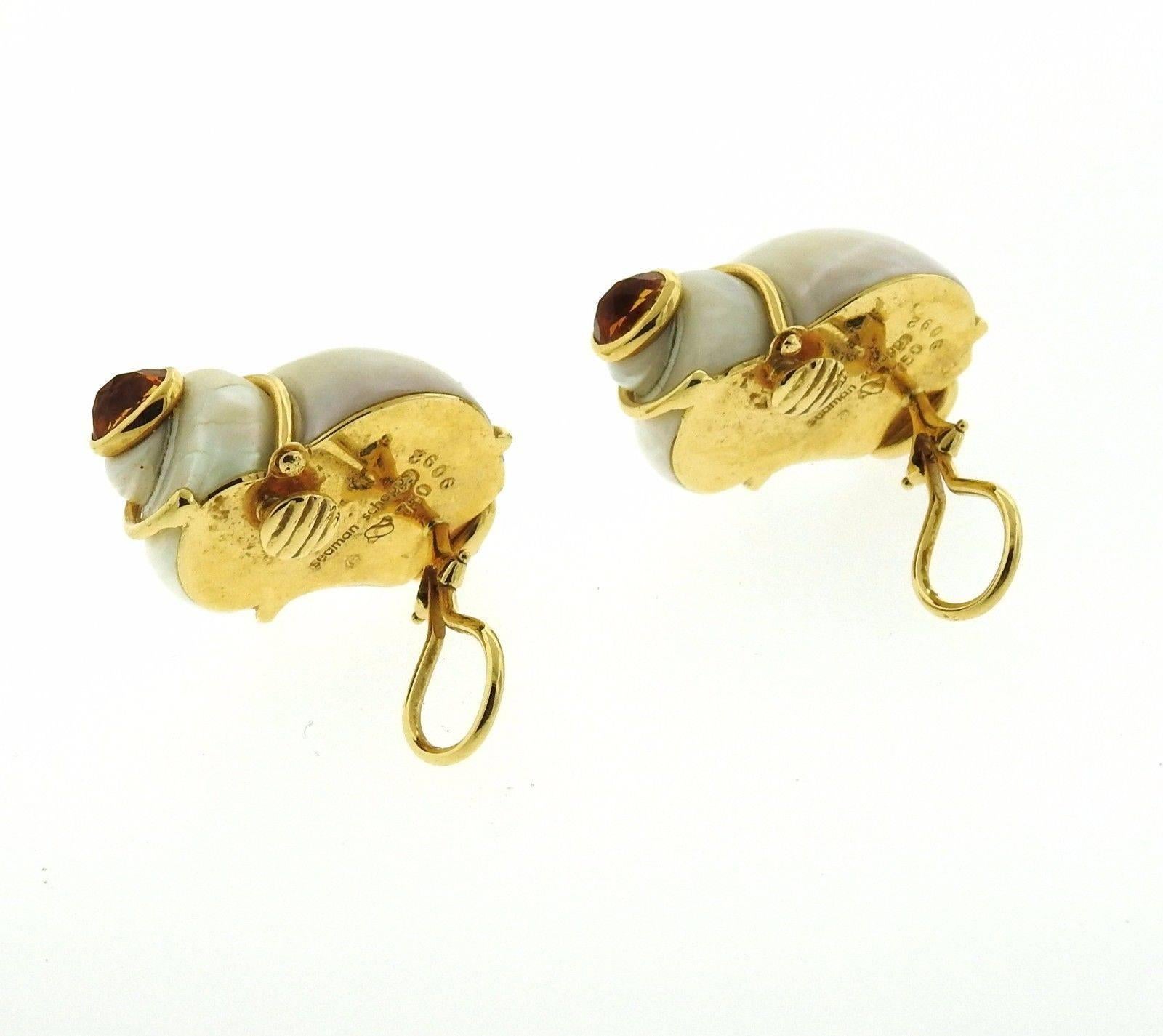 A pair of 18k yellow gold shell earrings set with citrines.  The earrings measure 30mm x 22mm and weigh 25.3 grams. Marked: Seaman Schepps, Shell mark, 9092, 750