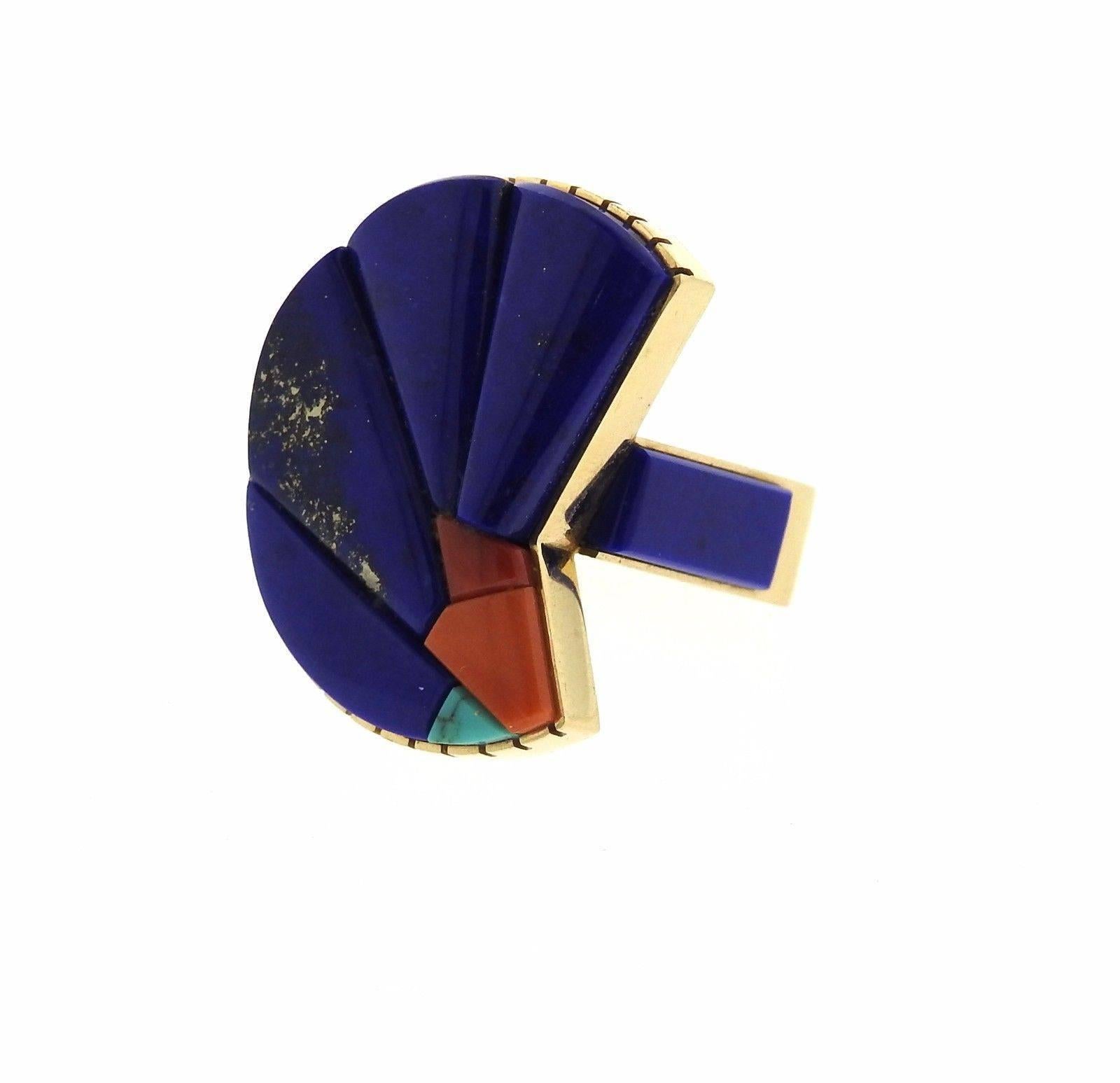 A 14k yellow gold ring set with Lapis, Coral and Turquoise.  The ring is a size 7, top measures 30mm x 25mm.  The weight of the piece is 19.2 grams.  Marked with the maker's hallmark. 
