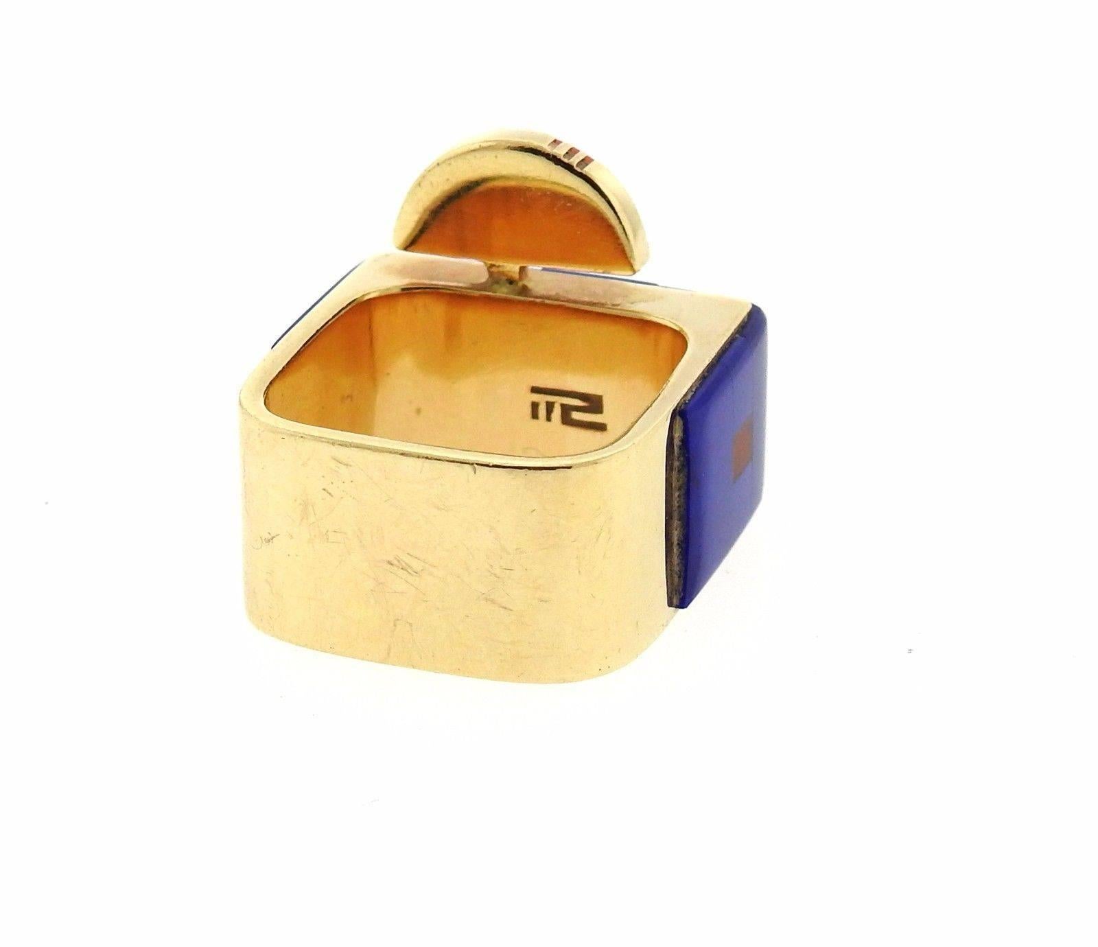 A 14k yellow gold ring set with coral, turquoise and lapis.  The ring is a 6 3/4, ring top is 19mm wide.  The weight of the piece is 14.7 grams.  Marked with the makers hallmark.
