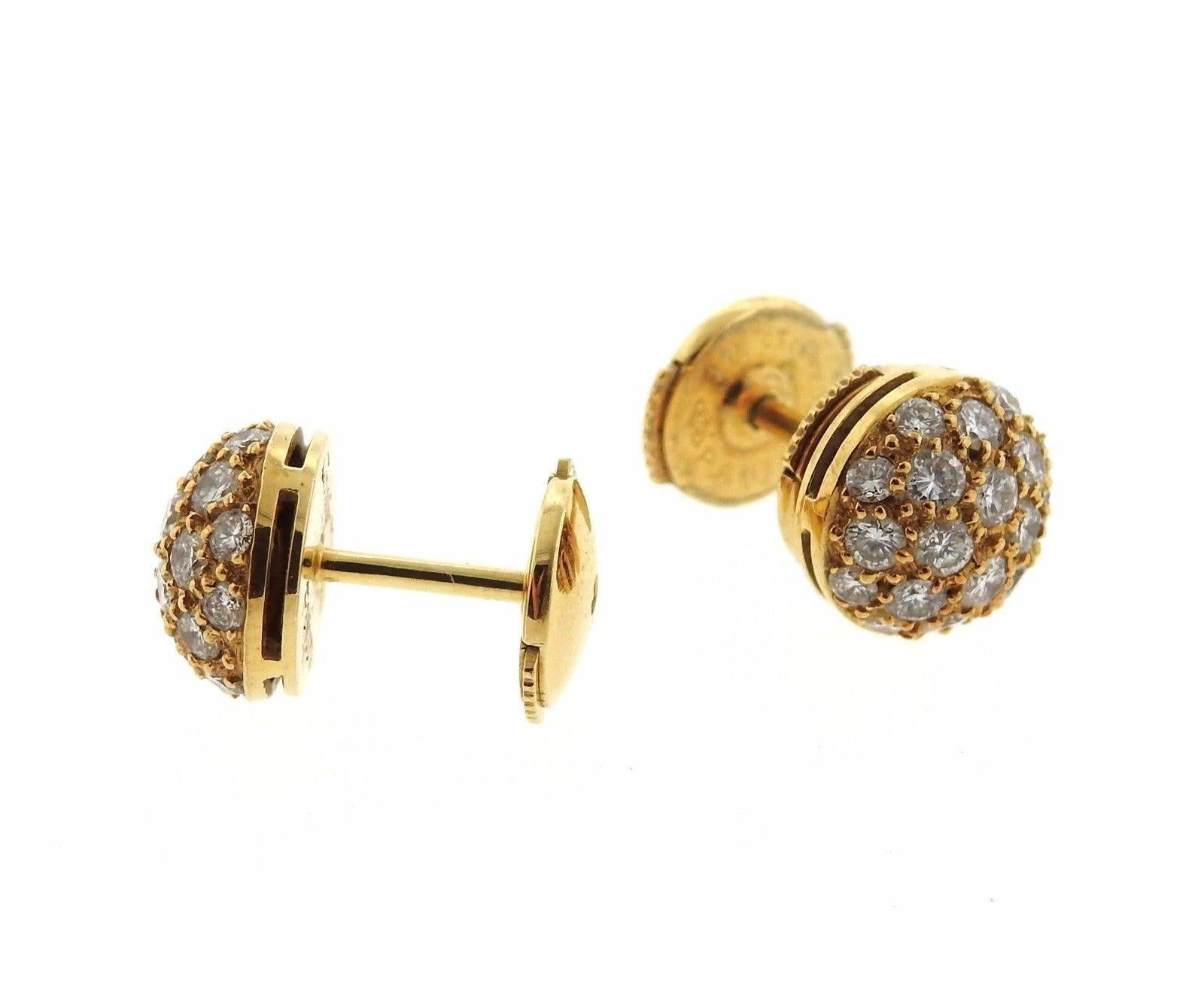 A pair of 18k yellow gold earrings set with approximately 1.50ctw of G/VS diamonds.  The earrings are 8.5mm in diameter and weigh 3.5 grams.  Marked: F19079, Cartier, 750.  Retail is $9500.