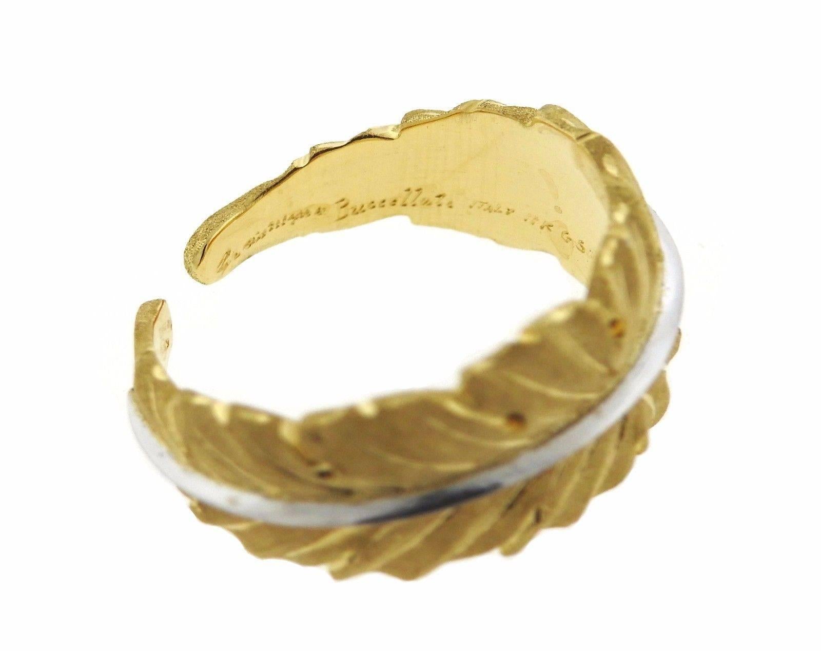 An 18k yellow and white gold leaf motif ring.  The ring is a size 7 and is 9.1mm wide.  The weight of the piece is 6.3 grams.  Marked: 18k , G5084,  Gianmaria Buccellati , Italy.  The current retail is $5330.
