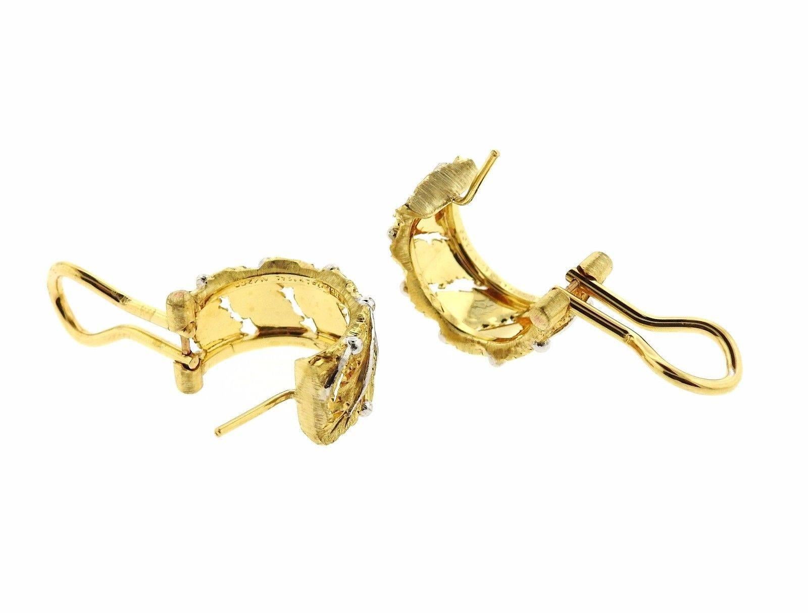 A pair of 18k yellow and white gold hoop earrings by Buccellati.  The earrings are 18mm in diameter and 8mm wide.  The weight of the pair is 10.7 grams.  Marked: Buccellati, Italy, 18k.  Current retail is $8840