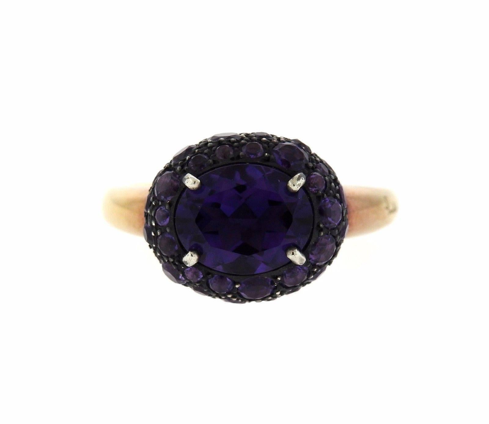 An 18k rose gold and burnished silver ring set with Amethyst.  The ring is a size 6 1/2 and the top is 12.5mm x 15mm.  The weight of the piece is 9.9 grams. Marked: Pomellato, 750.