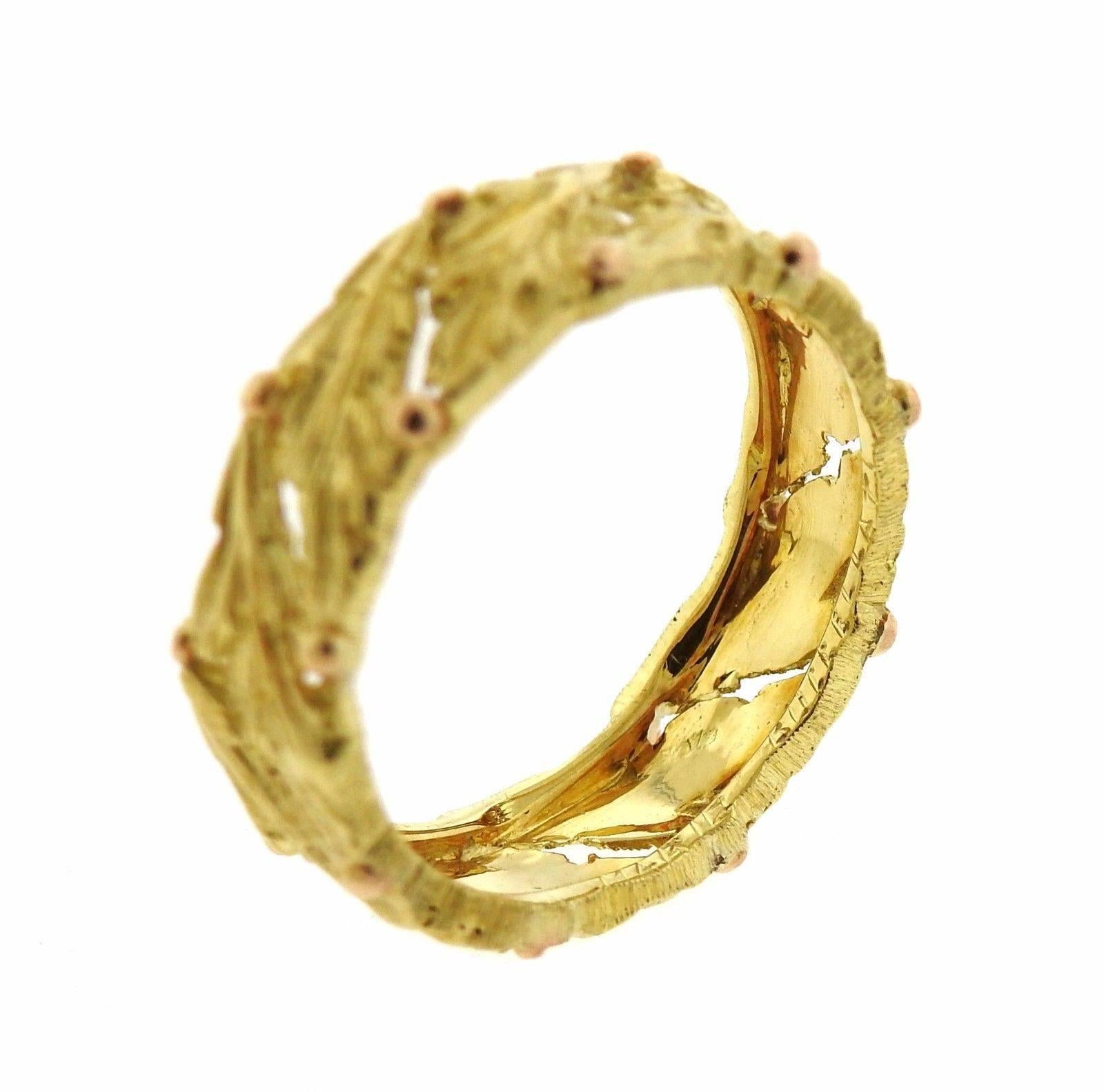 An 18k yellow gold leaf motif band ring by Mario Buccellati.  The ring is a size 5 1/2 amd os 5.5mm wide.  The weight of the piece is 3.2 grams. Marked: 750, Mario Buccellati.  Current retail is $2600.